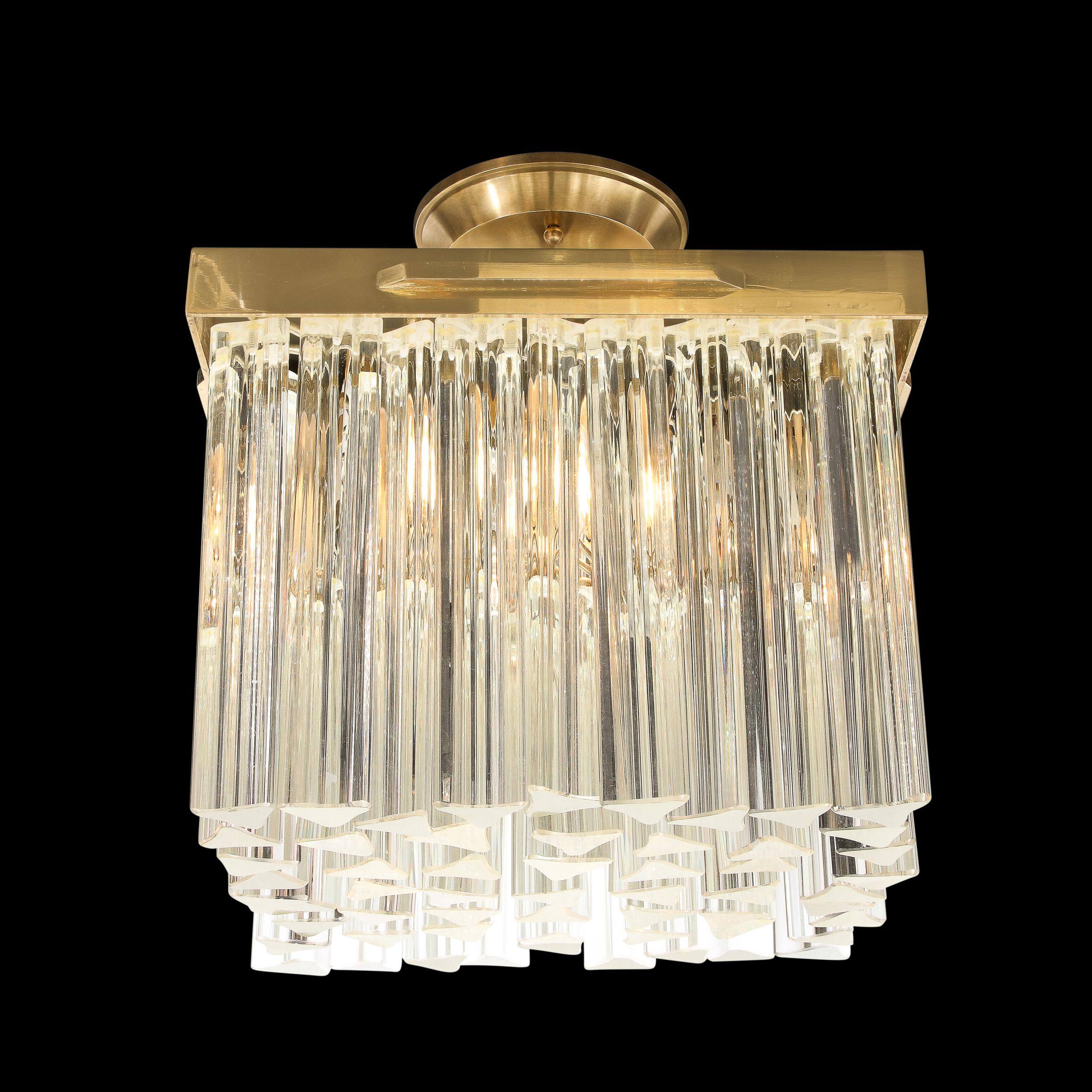 This arresting Mid-Century Modern chandelier was realized in Murano, Italy- the island off the coast of Venice renowned for centuries for its superlative glass production- circa 1975. It features an abundance of camer crystals (one of the most
