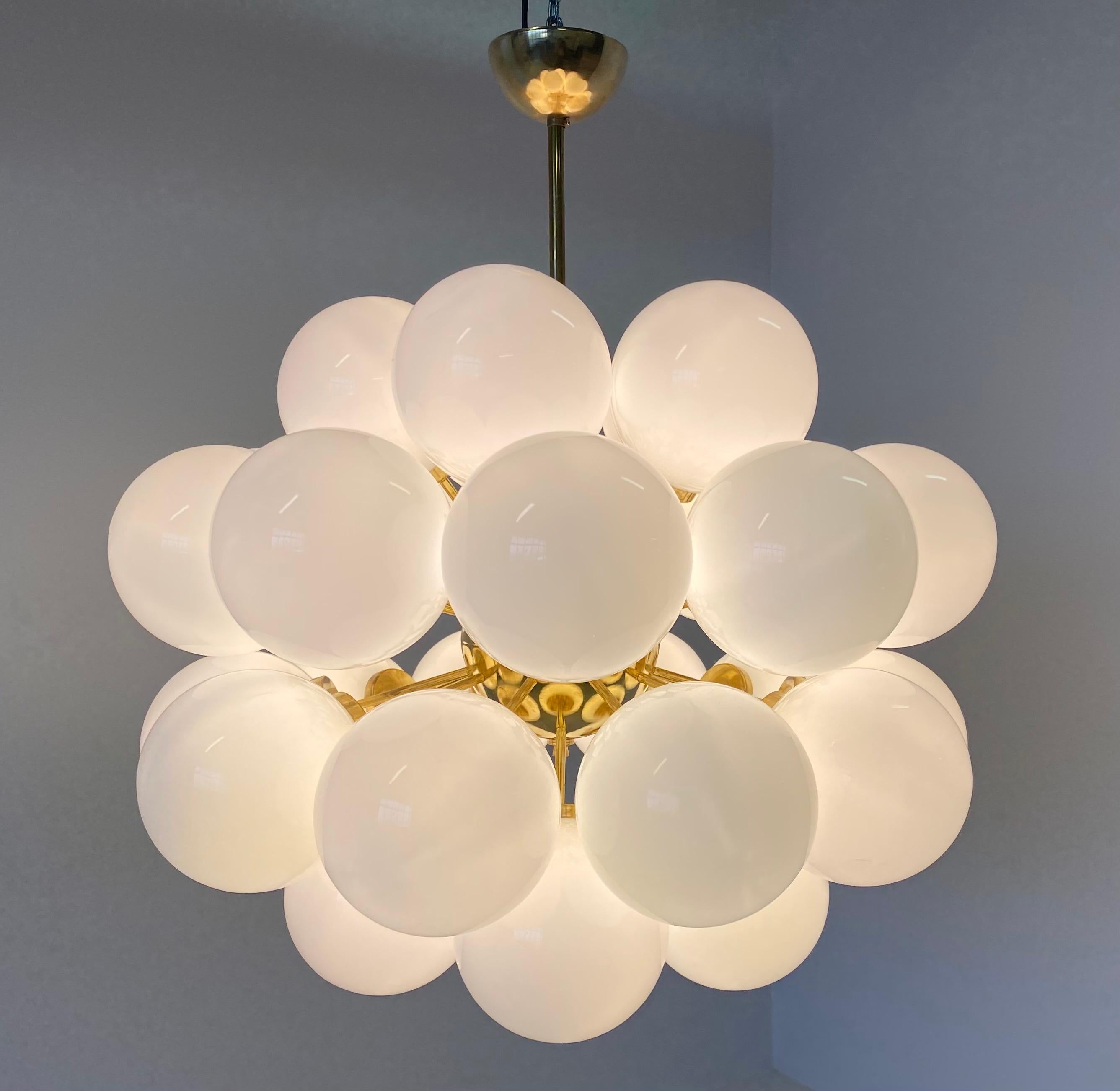 This chandelier was produced in Murano in a mid-century style and it is composed of 30 glass spheres while the structure is in brass.
Perfect conditions.