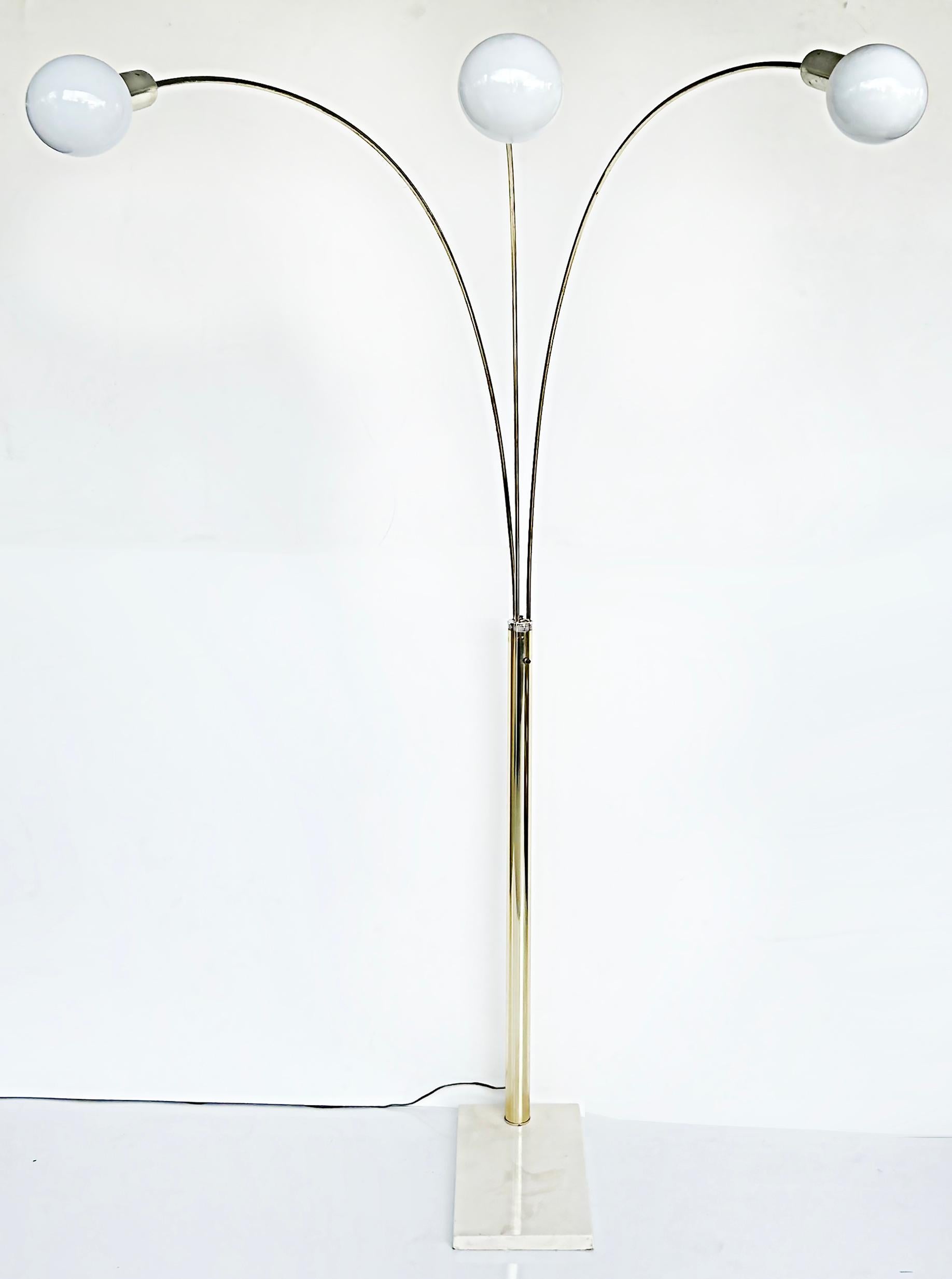 Mid-Century Modern Brass Arched Floor Lamp, Marble Base

Offered for sale is a recent acquisition from a Miami Beach estate, a Mid-Century Modern brass floor lamp with three arched arms supported by a cream-colored marble base. This lamp
