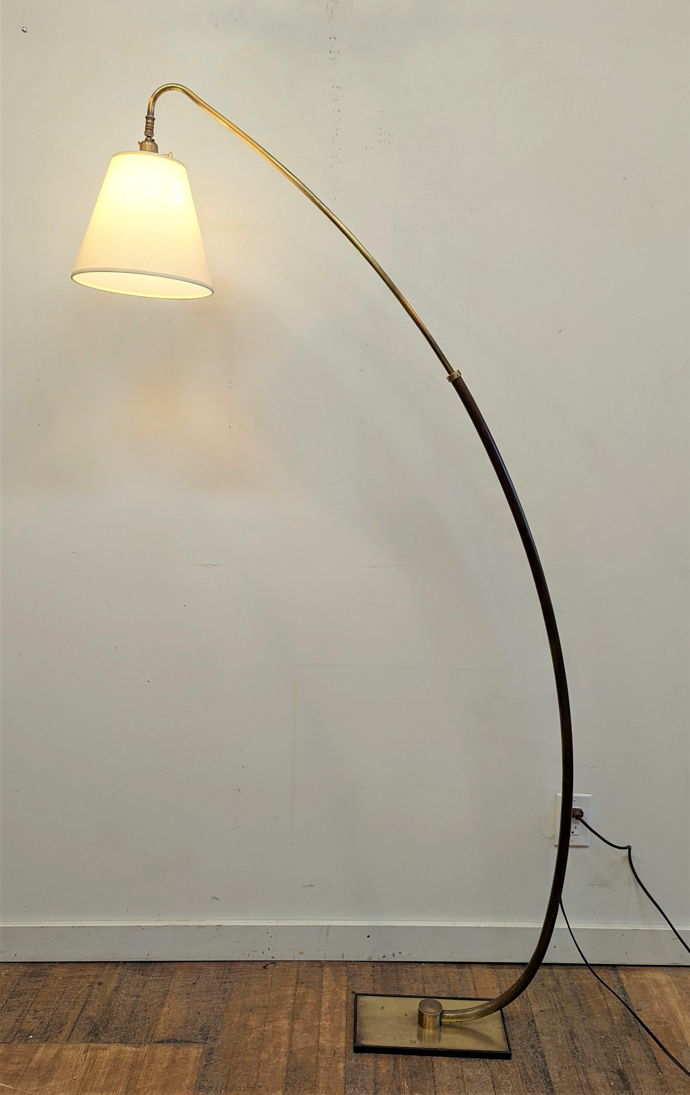 Mid-Century Modern brass articulating floor lamp. All brass arched mid century modern floor lamp with adjustable height and some Directional movement to the shade. Slide is easy and works well. Please note the sensational patina to main brass pole