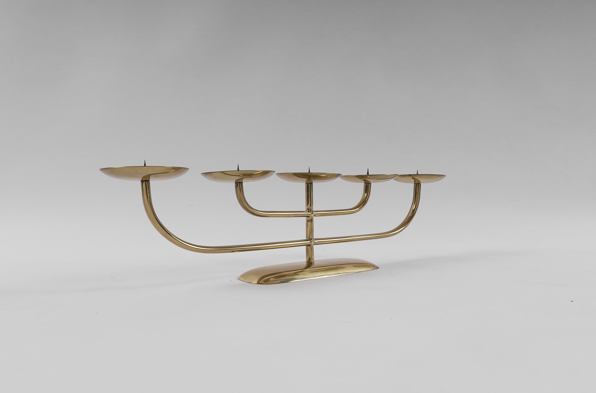 Handmade and probably no longer find so. Solid brass, beautifully patinated. Simple and elegant.