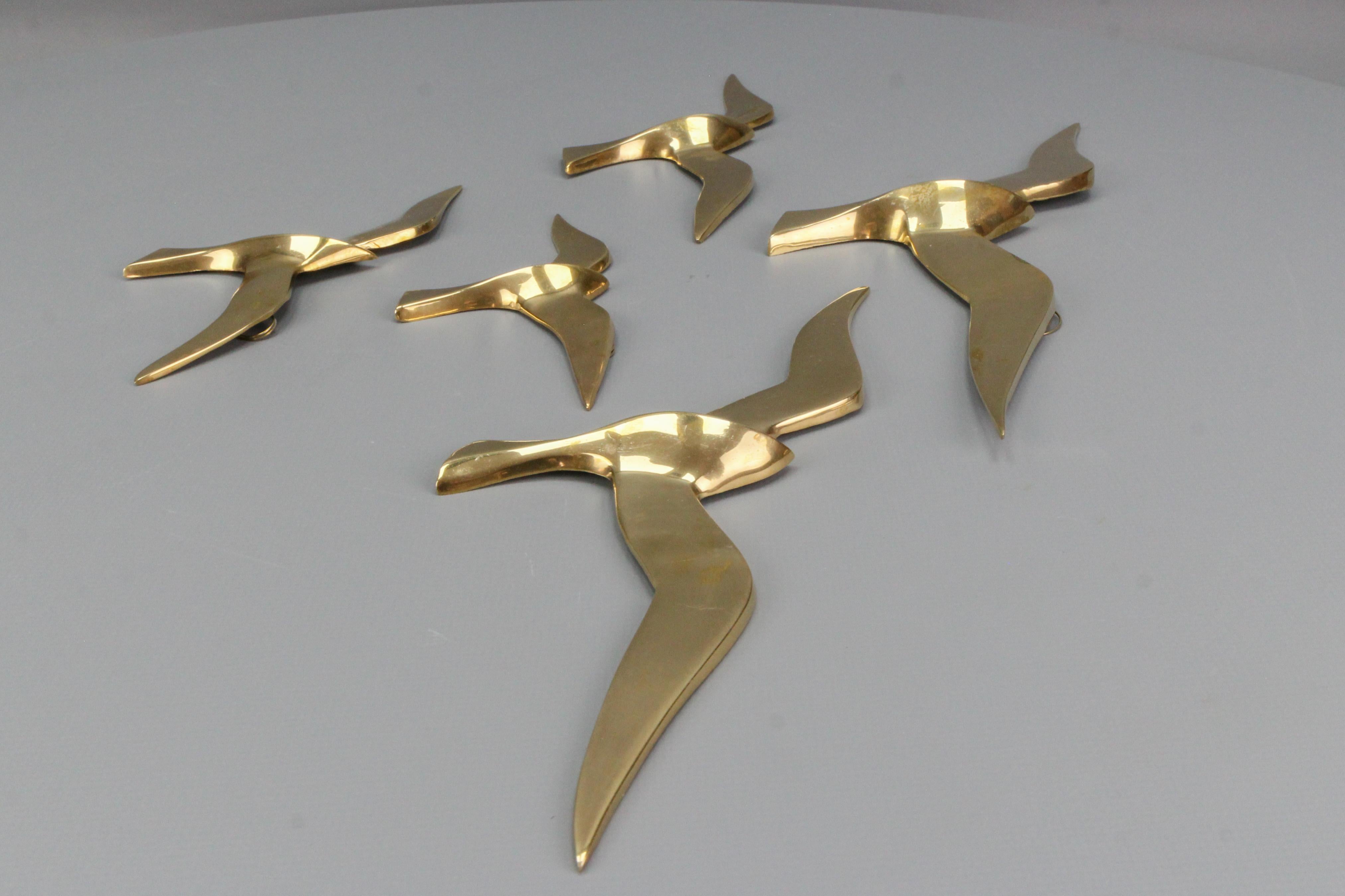 A beautiful Mid-Century Modern bird wall decoration - seagull figures made of brass, set of five, from circa the 1970s.
The dimensions of the largest bird figure: 
Dimensions: height: 12 cm / 4.72 in; width: 34 cm / 13.38 in; depth: 3 cm / 1.18