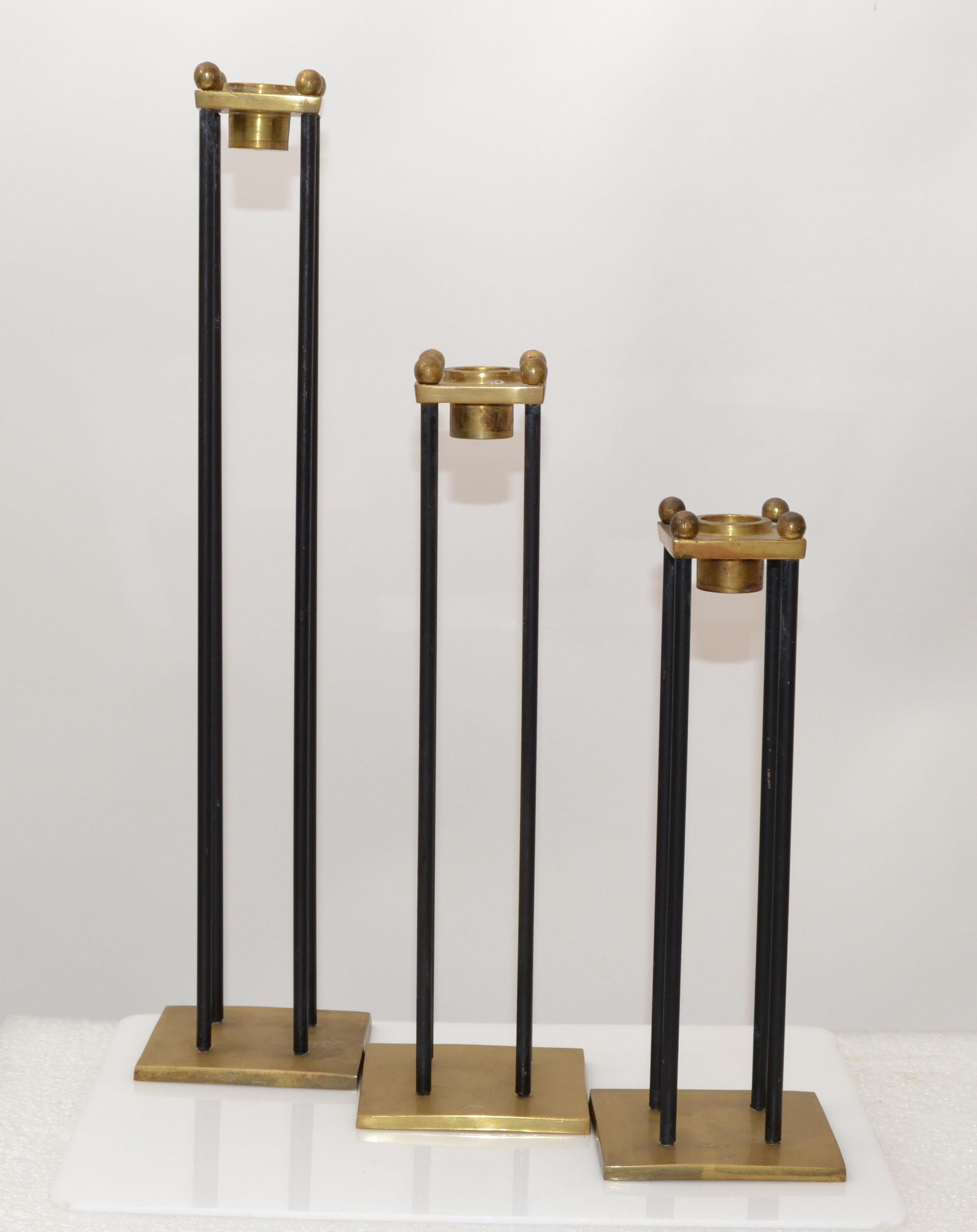 Set of three Nesting Mid-Century Modern black Enamel and Brass candle holders or candlesticks.
The set is very old and we intentionally left the brass in its original condition.
They come in three sizes: 15.5 inches, 11.5 inches, 9.5 inches height.