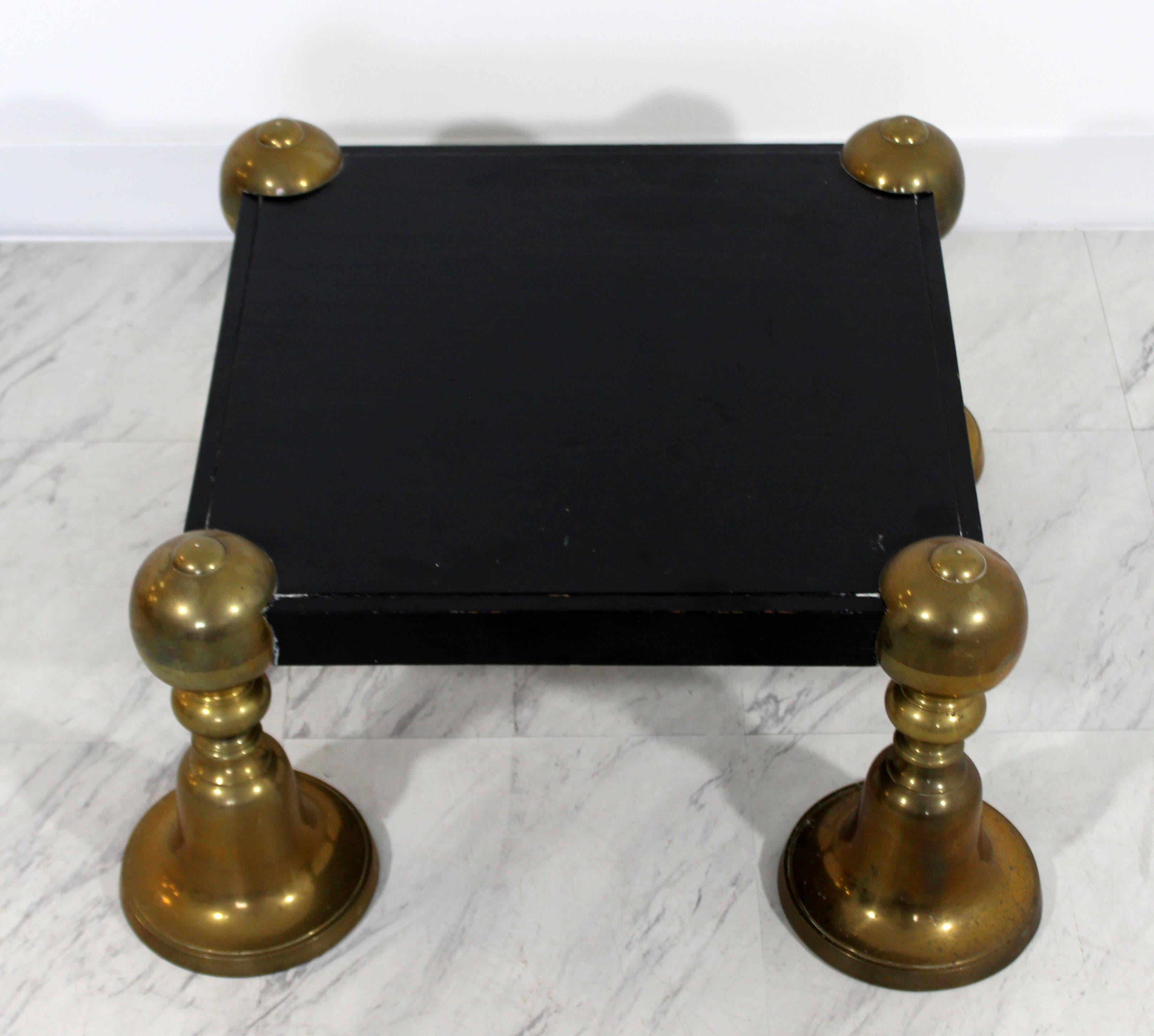 For your consideration is a wonderful, short, square black painted wood pedestal, with brass legs, in the style of Tommi Parzinger, circa 1960s. In excellent condition. The dimensions are 22