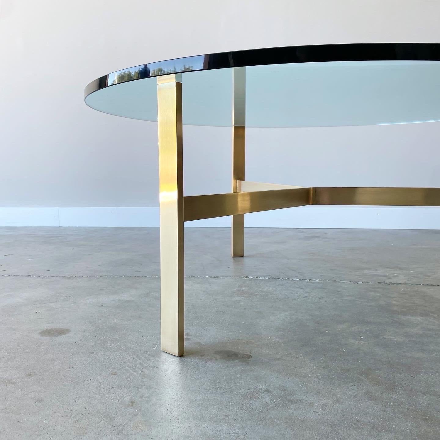Minimal yet striking. A simple solid brass base, very well executed. Thick glass top, age appropriate wear throughout.

42” diameter, 16 1/2” high


In the manner of Tommi Parzinger