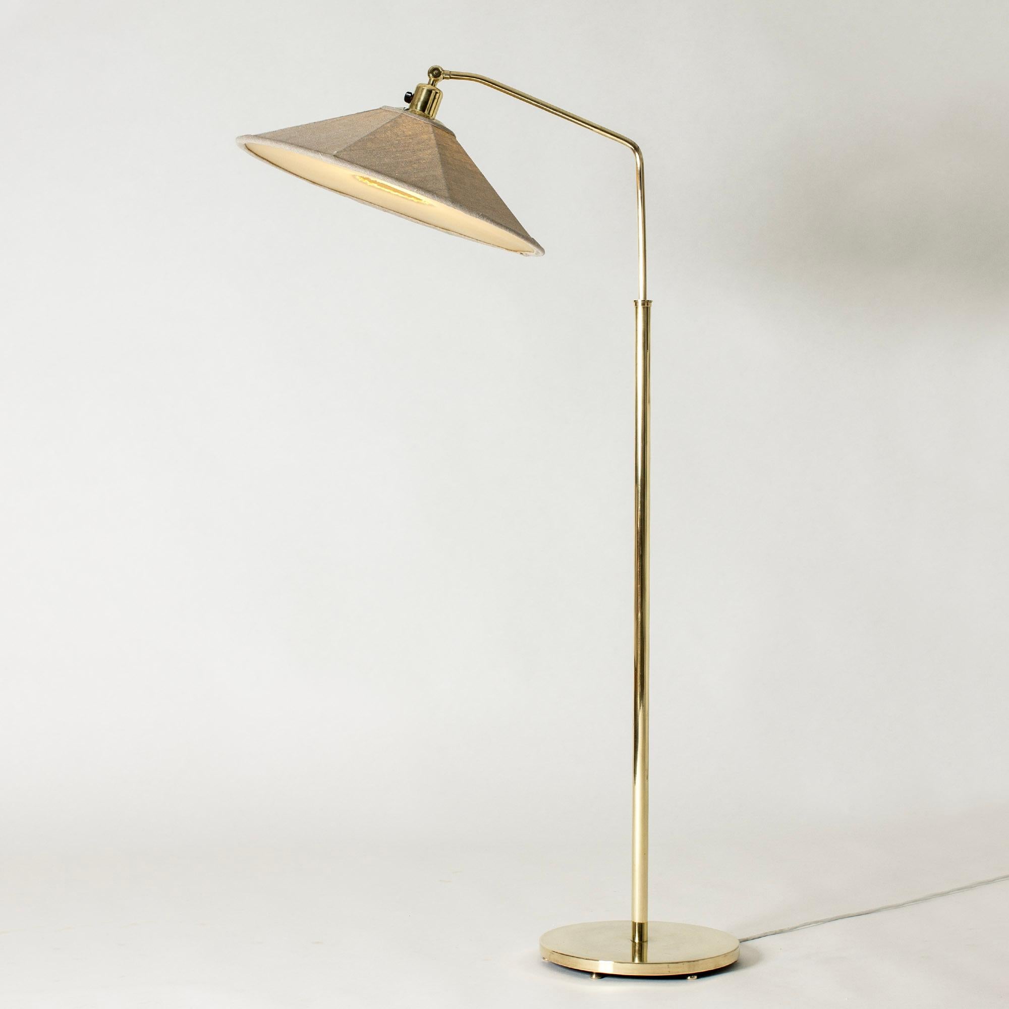 Rare, elegant floor lamp from Böhlmarks, made from brass with a wide textile shade. Possible to adjust the height by almost 40 centimeters. A very contemporary, sleek design.

Height 133-171 cm.