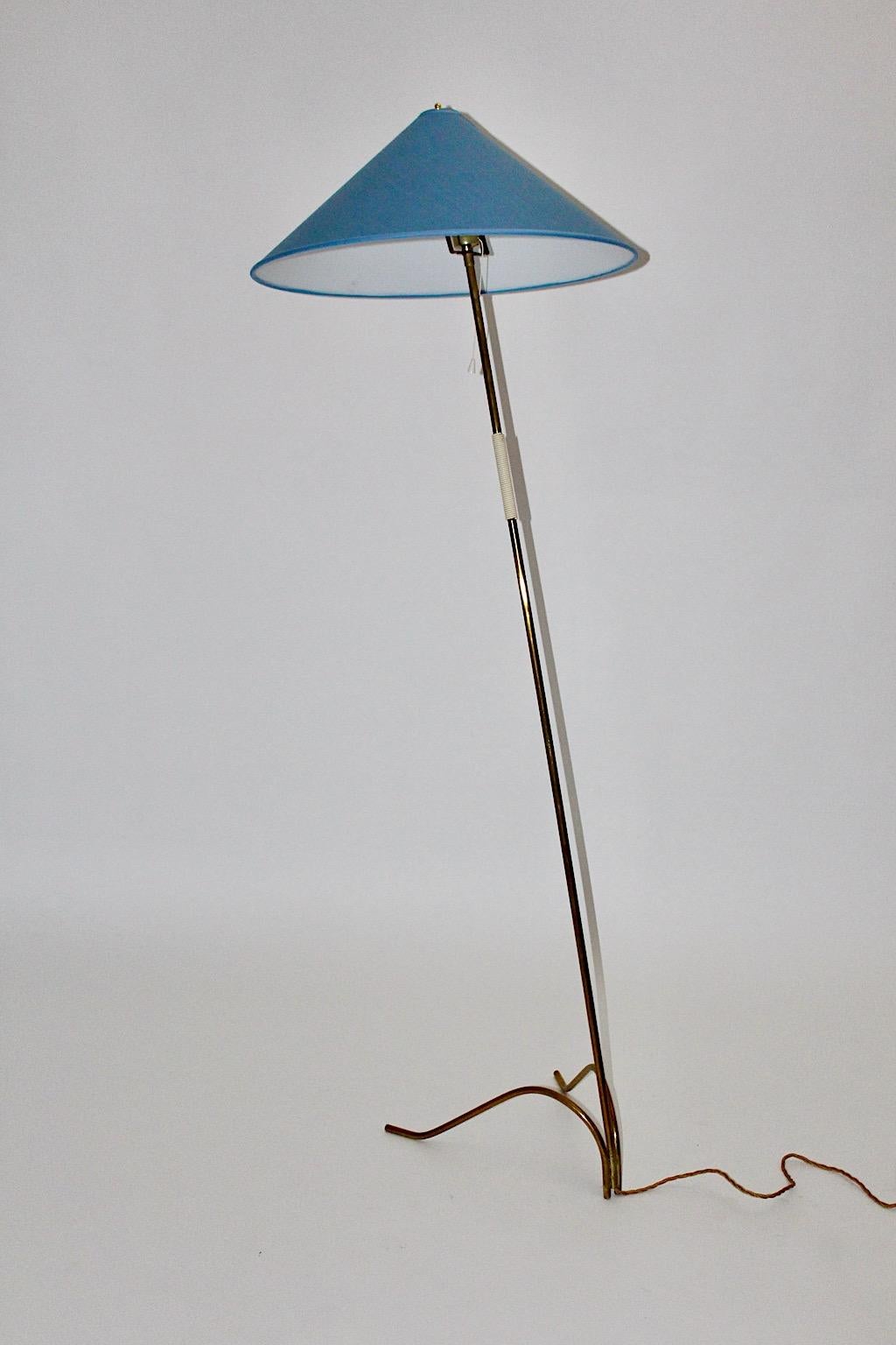 Mid-Century Modern brass floor lamp by Rupert Nikoll 1950s, Vienna.
A beautiful and iconic floor lamp from brass with a plastic string handle for an easy handling.
While the base features a significant splayfoot from brass, we decided to  replace