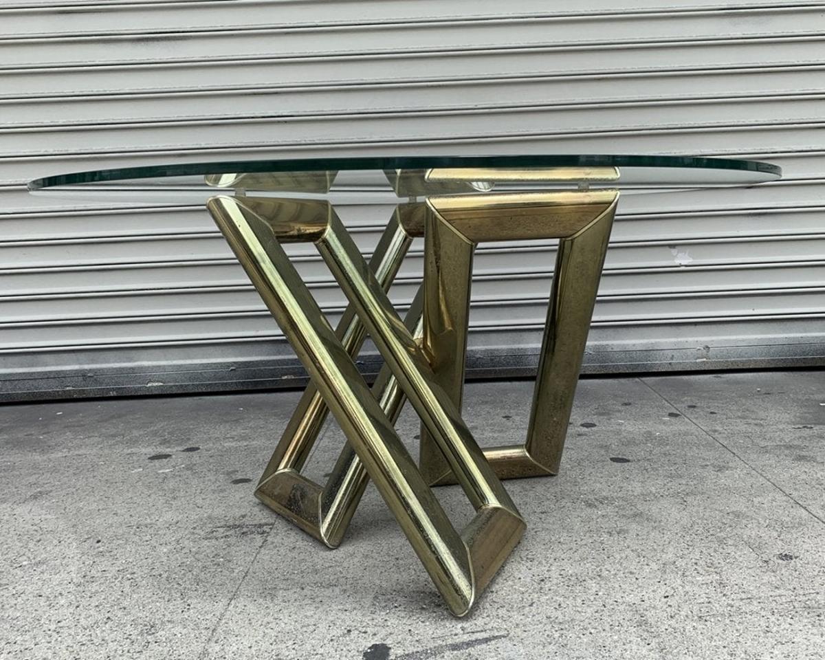 Description
Mid-Century Modern brass and glass coffee table.
The table is very sculptural and shows very well, no identifying markings.
The brass shows wear and oxidation, needs to be polished, the brass shows scratches and on one side has
