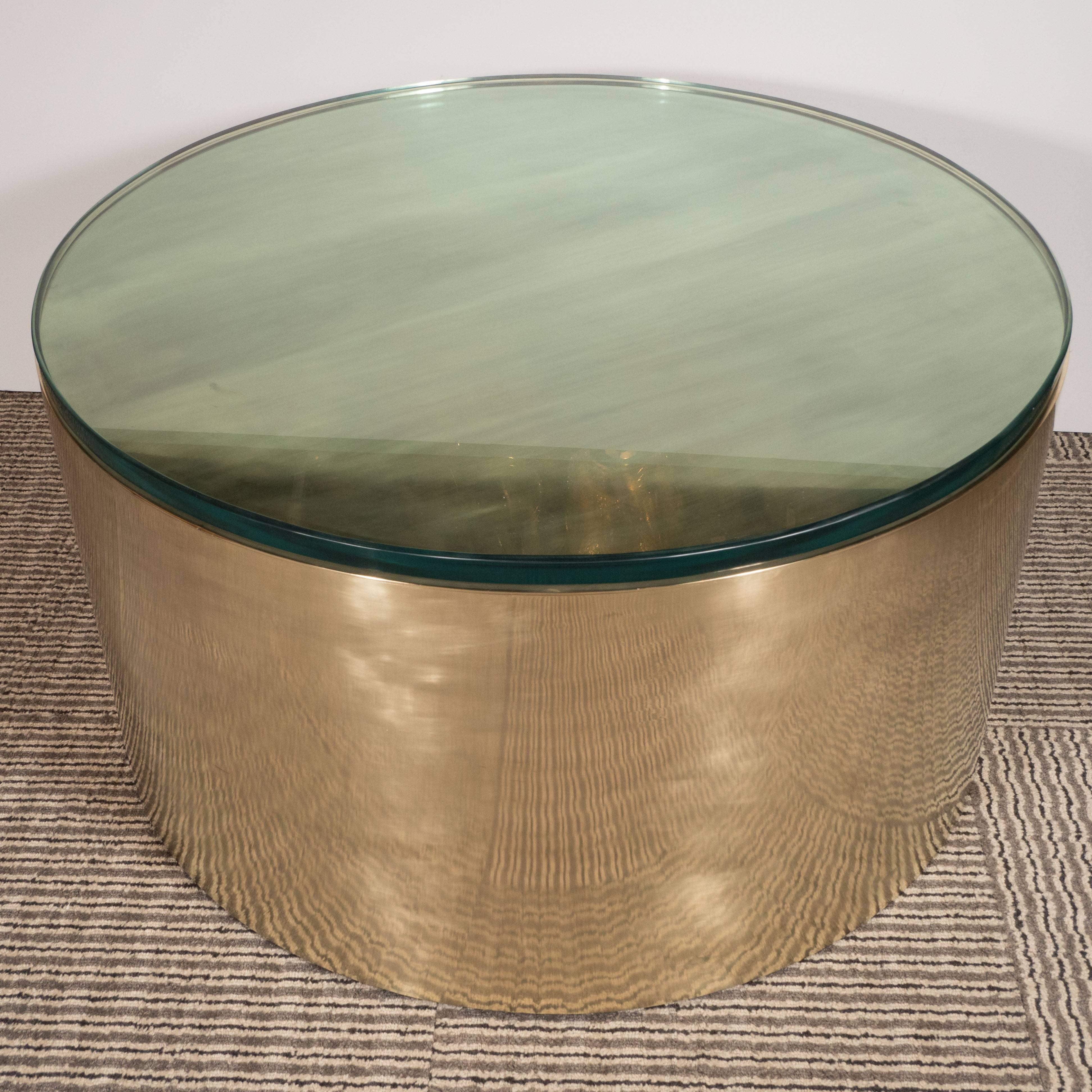 This stunning cocktail table was designed by Noel Jeffrey and custom fabricated, by hand, in the United States, circa 1980. With its austere form and bold palette of lustrous brass, this table exemplifies American design from the period at its best.