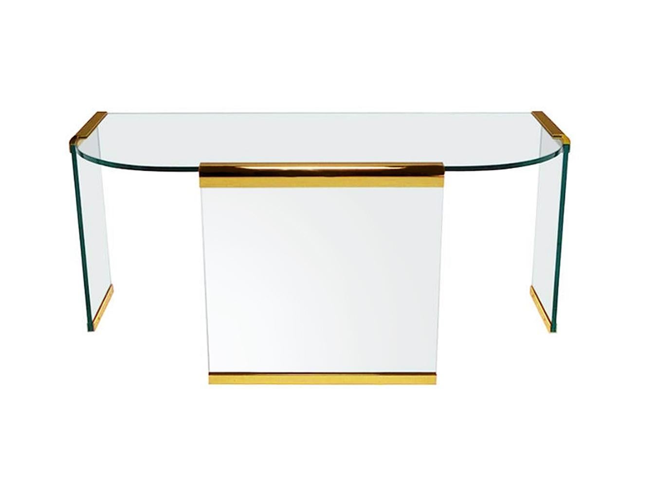 A chic and substantial glass and brass table or desk designed by Leon Rosen for Pace collection. This desk feature heavy thick 3/4 inch glass with solid brass brackets.