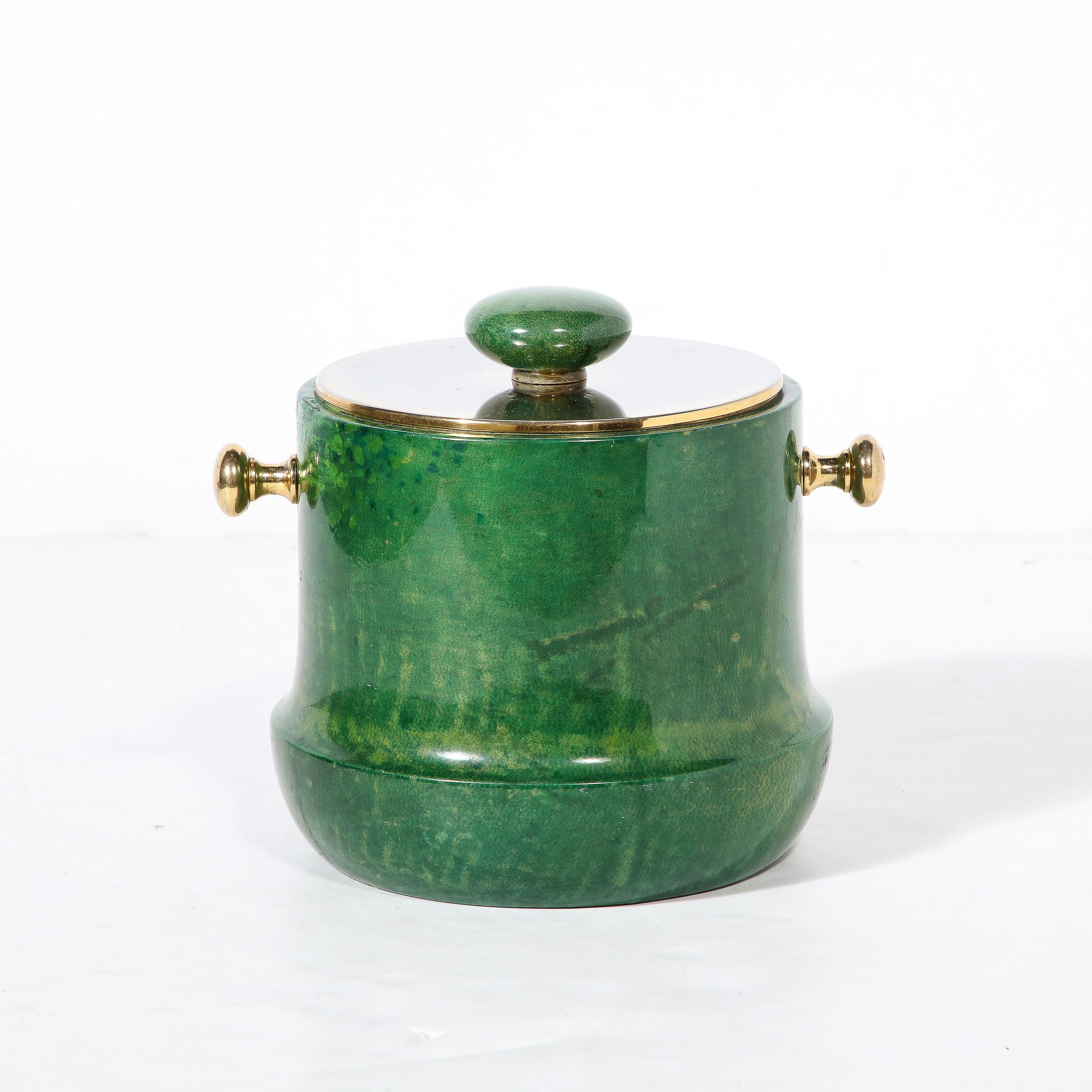 This gorgeous Mid-Century modernist Brass and Lacquered Viridian Goatskin Ice Bucket is by the esteemed artist and designer Aldo Tura, originating from Italy, Circa 1970. Features a beautiful profile slightly wider at the base giving an excellent