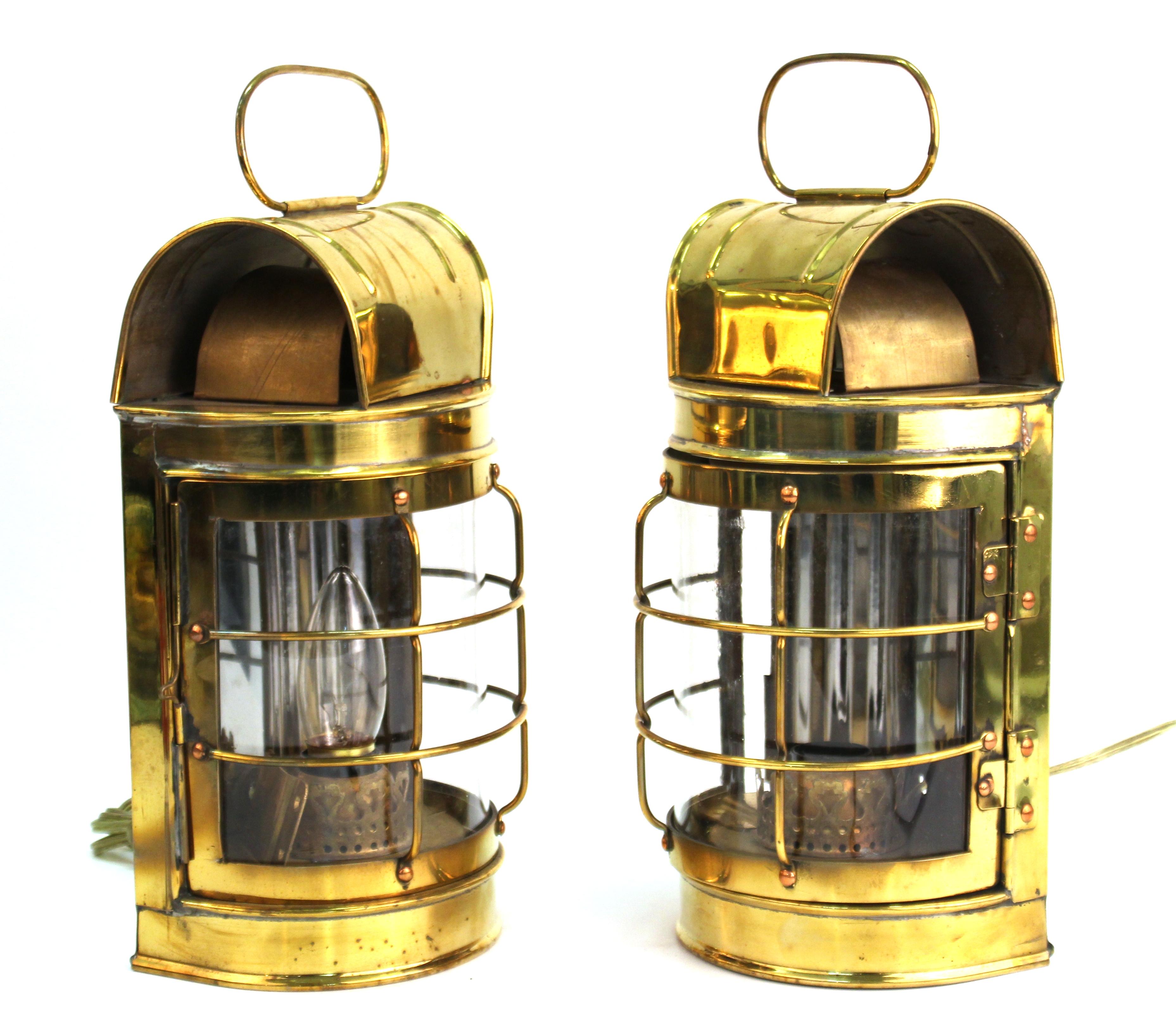 Mid-Century Modern pair of wall sconces in the shape of brass lanterns. The pair was made during the 1970's and is in great vintage condition with very minor age-appropriate wear.