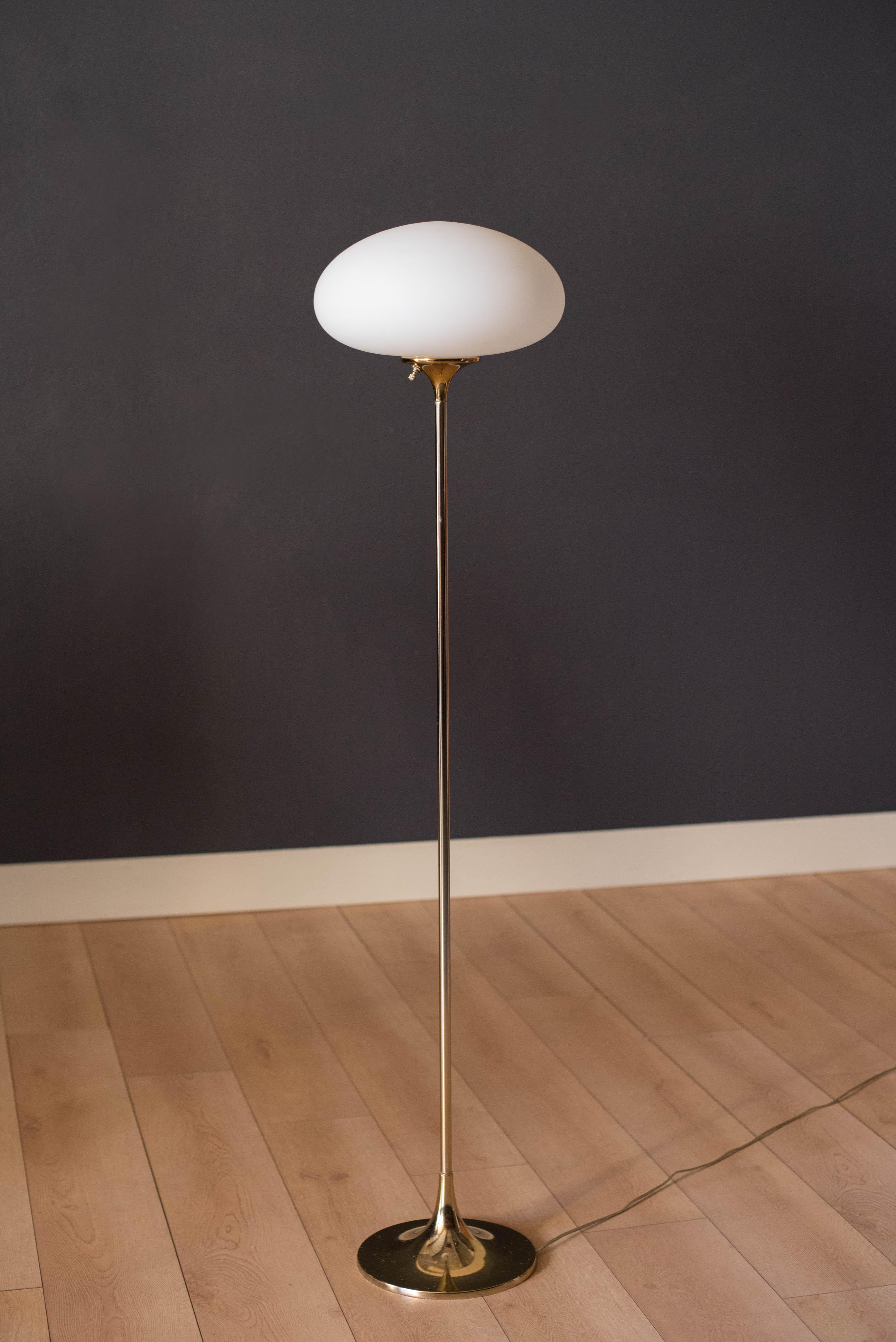 Mid-Century Modern Laurel floor lamp in brass. This piece features a frosted glass mushroom shade and includes a three-way switch.

Measure: Shade 13