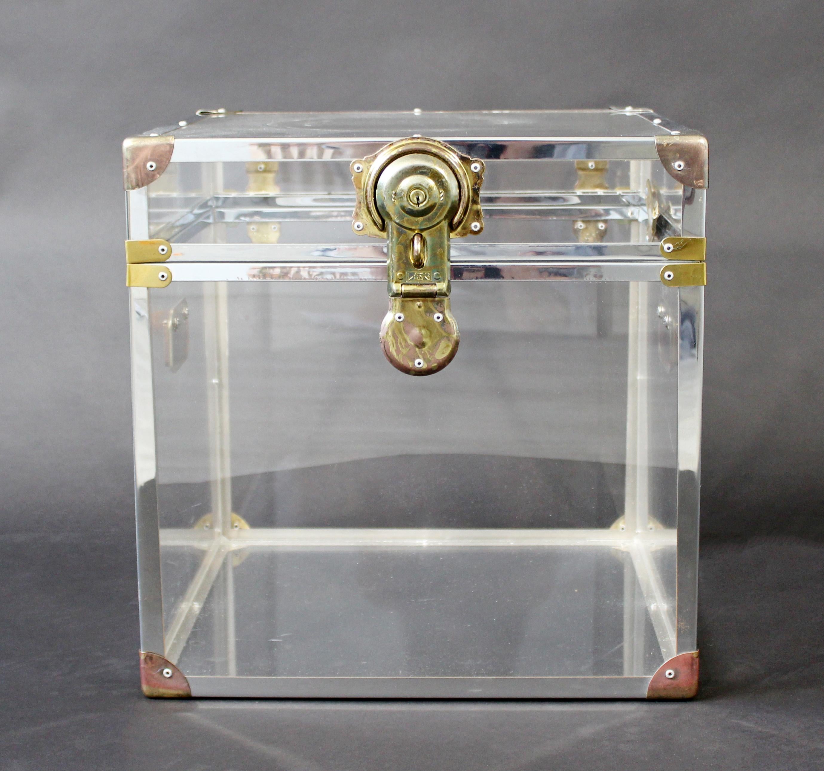 For your consideration is a fabulously chic side or end table and cabinet, made of Lucite with brass accents, circa the 1970s. In excellent vintage condition. The dimensions are 16