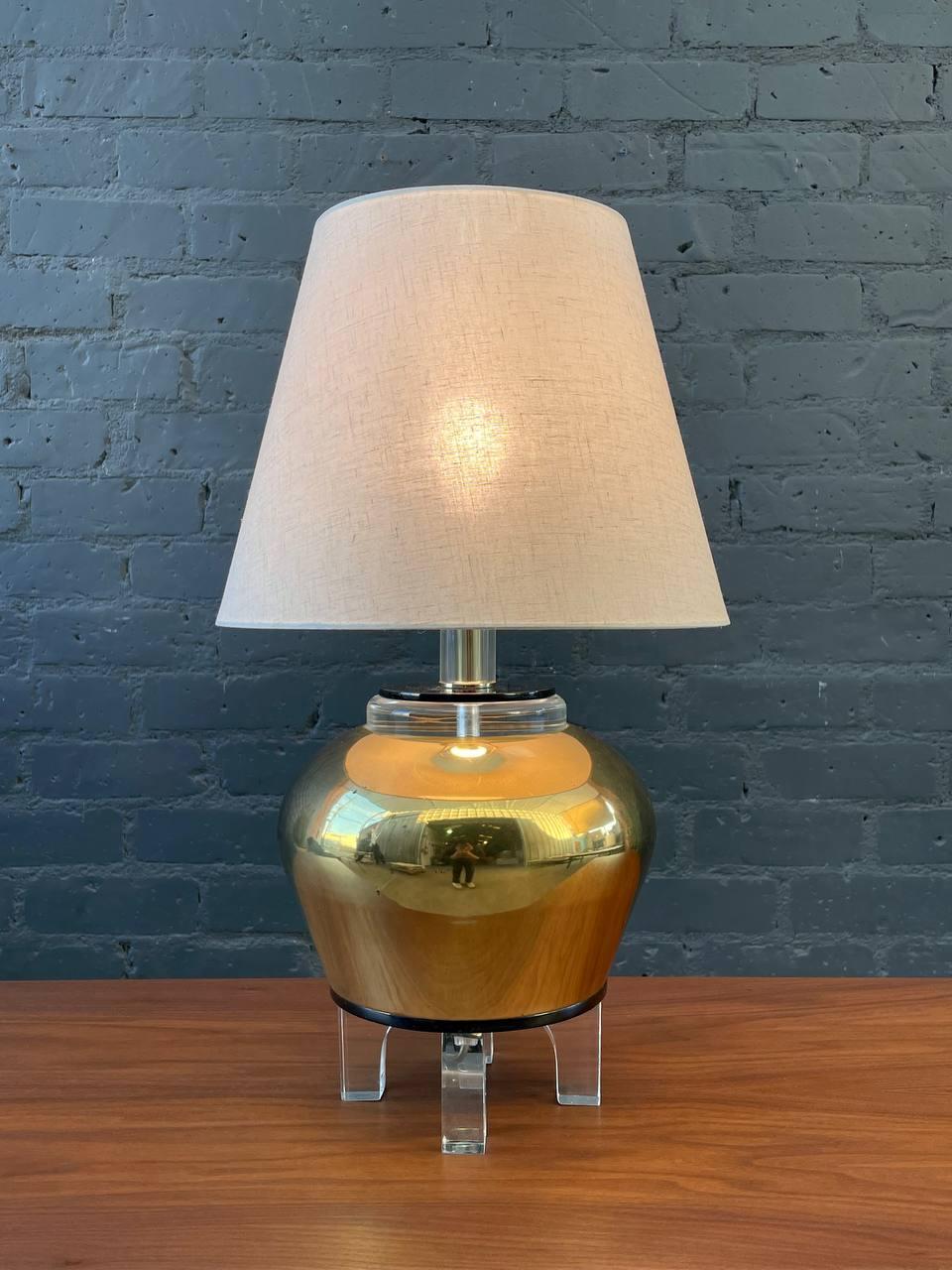 Newly Rewired, New Shade

Dimensions: 
23” H x 9” W x 9” D
Shade:
10.50” H x 8”-13” D

Materials: Patinated Brass, Lucite Base, New Shade 