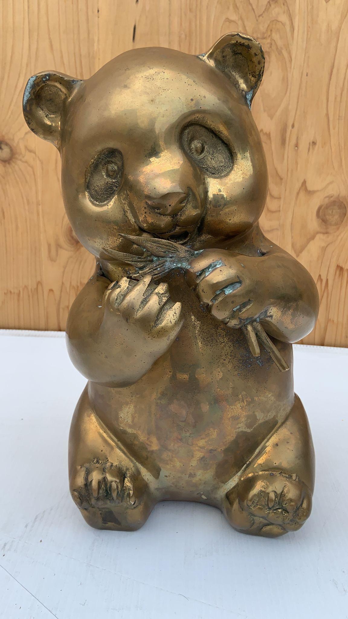 Mid Century Modern Brass Panda Statue Figurine 

Fun mid century modern sitting brass panda statue with foliage in hands.

