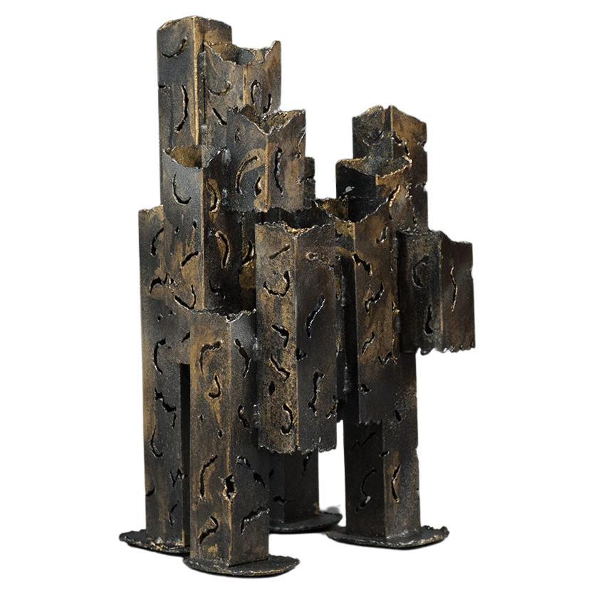 An extraordinary mid-century sculpture in good condition is crafted out of brass and features a unique design that would make it a wonderful addition to any sophisticated home decor for years to come.