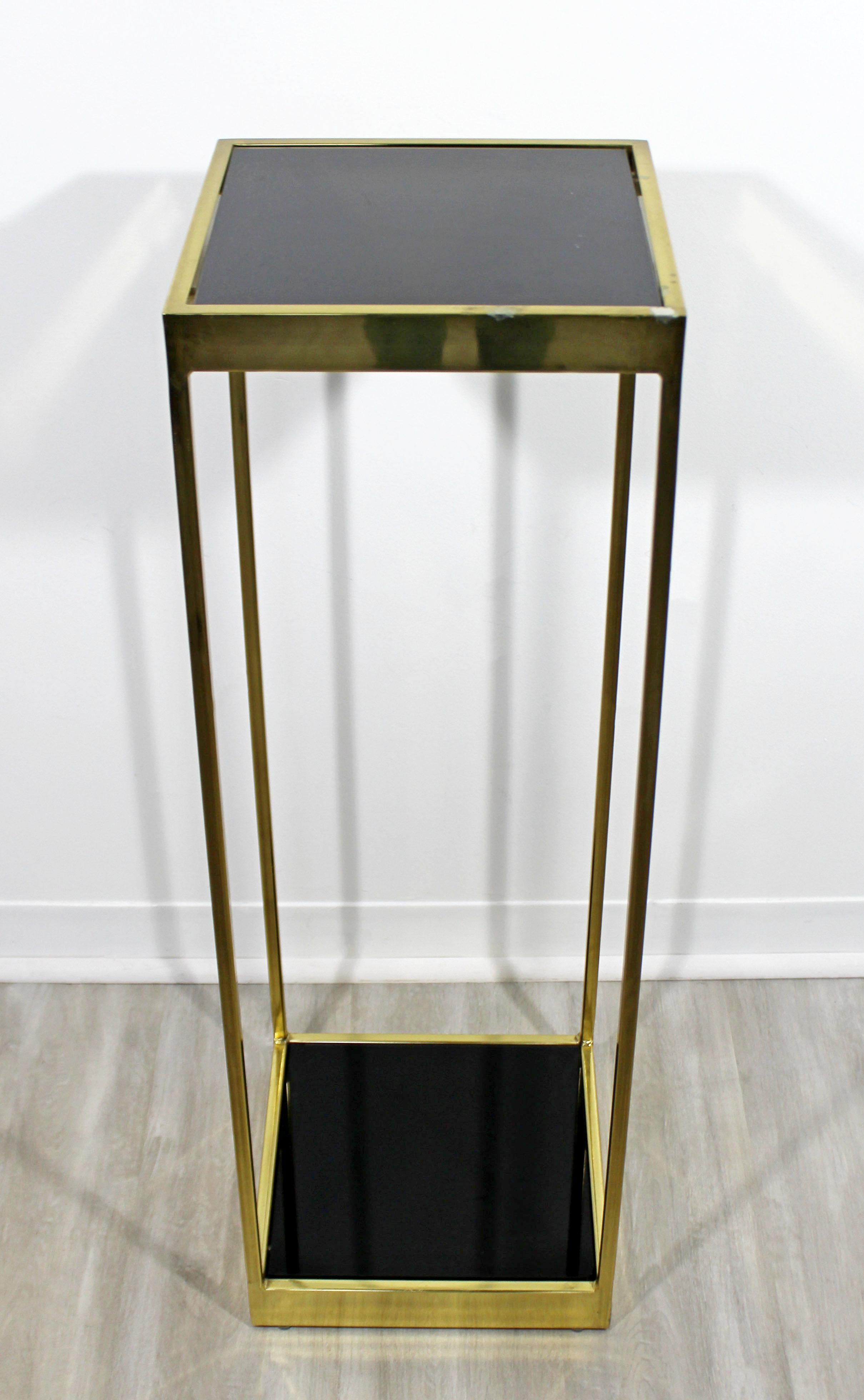 For your consideration is a fabulous, two-tiered display stand or planter, made of brass and with smoked glass inserts, circa 1960s. In good vintage condition. The dimensions are 12