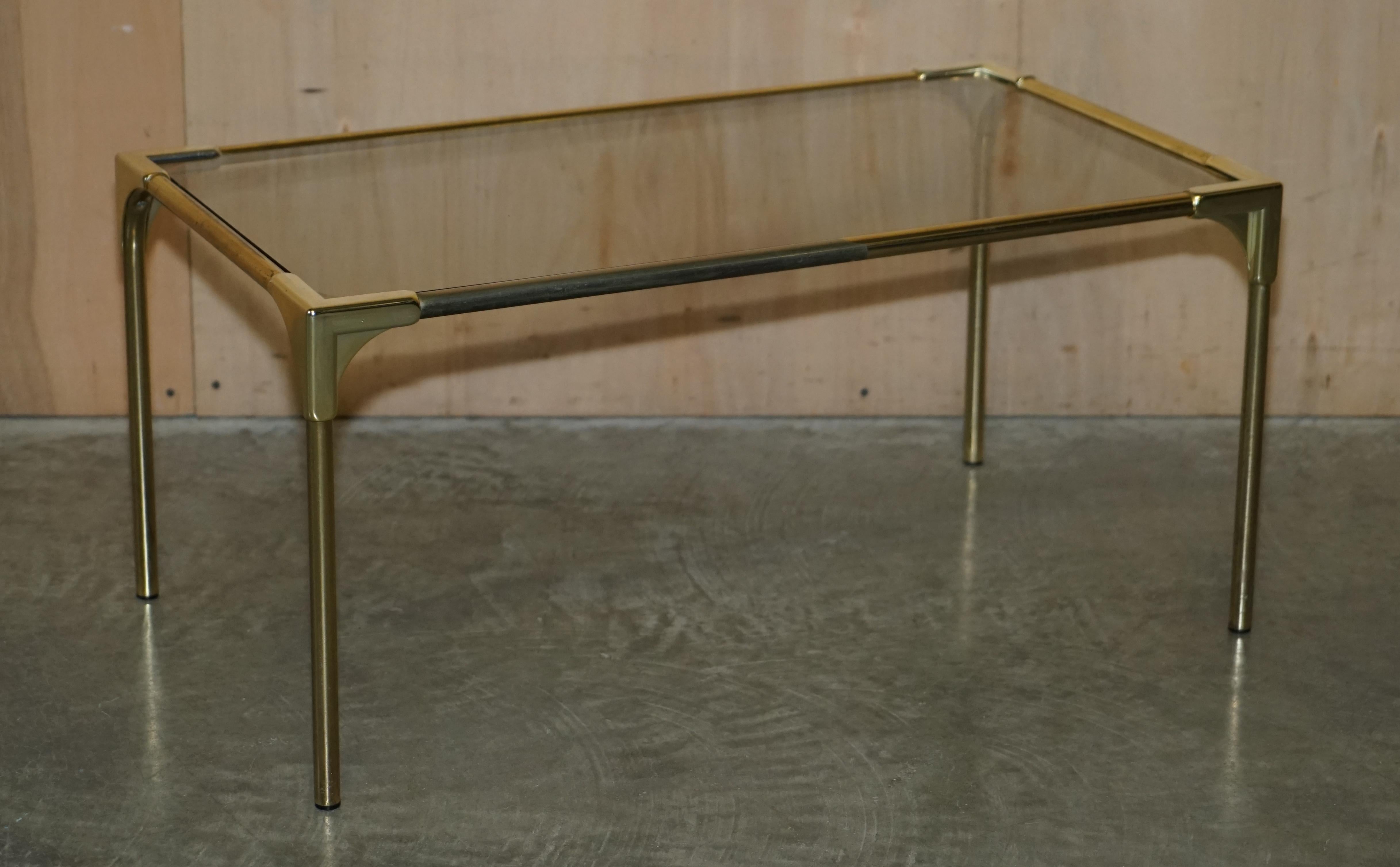 We are delighted to offer for sale this lovely suite of original circa 1960s Mid-Century Modern French Empire brass and smoked glass tables

This set of tables is very much on trend and will never be far from it, the lines are elegant and timeless