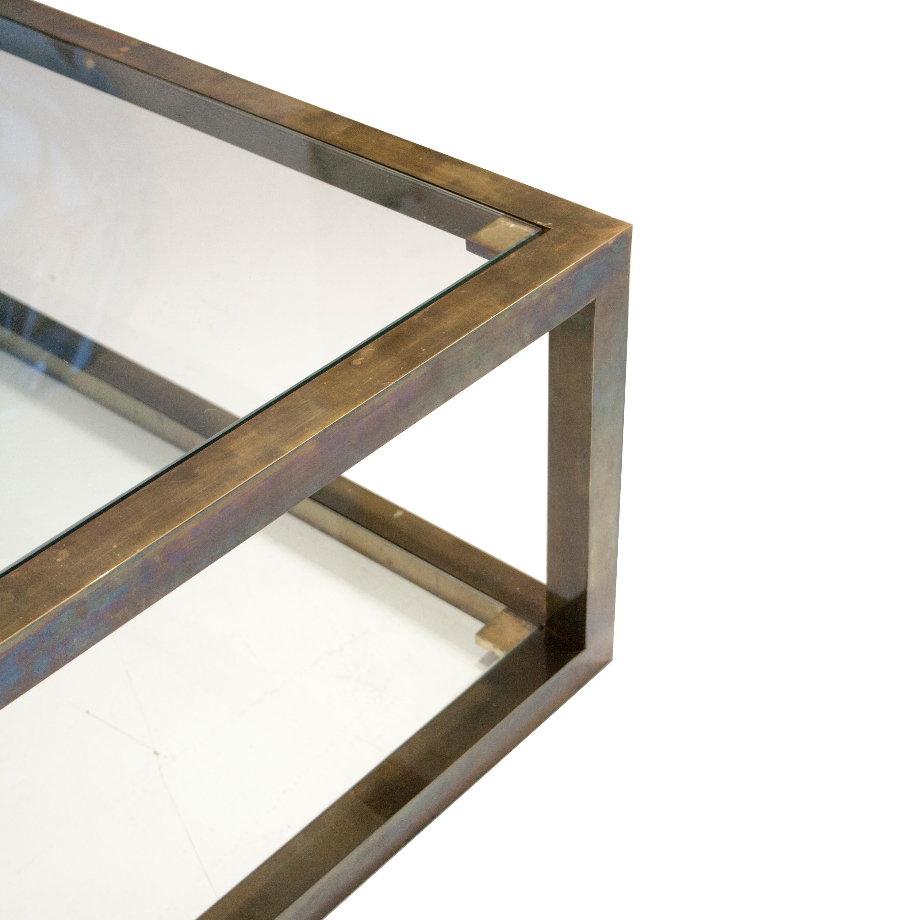 Square center table made of solid quared brass tube and glass.