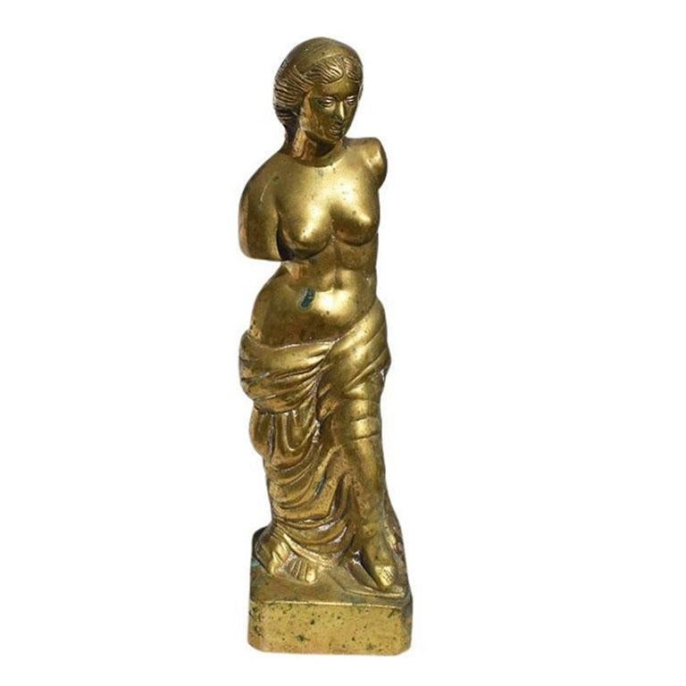In all of our years of collecting, we've never come across anything like this beautiful brass goddess statue. The piece is created from brass and is quite heavy. It depicts a Greek armless woman who wears a sheet draped around her waist. This would