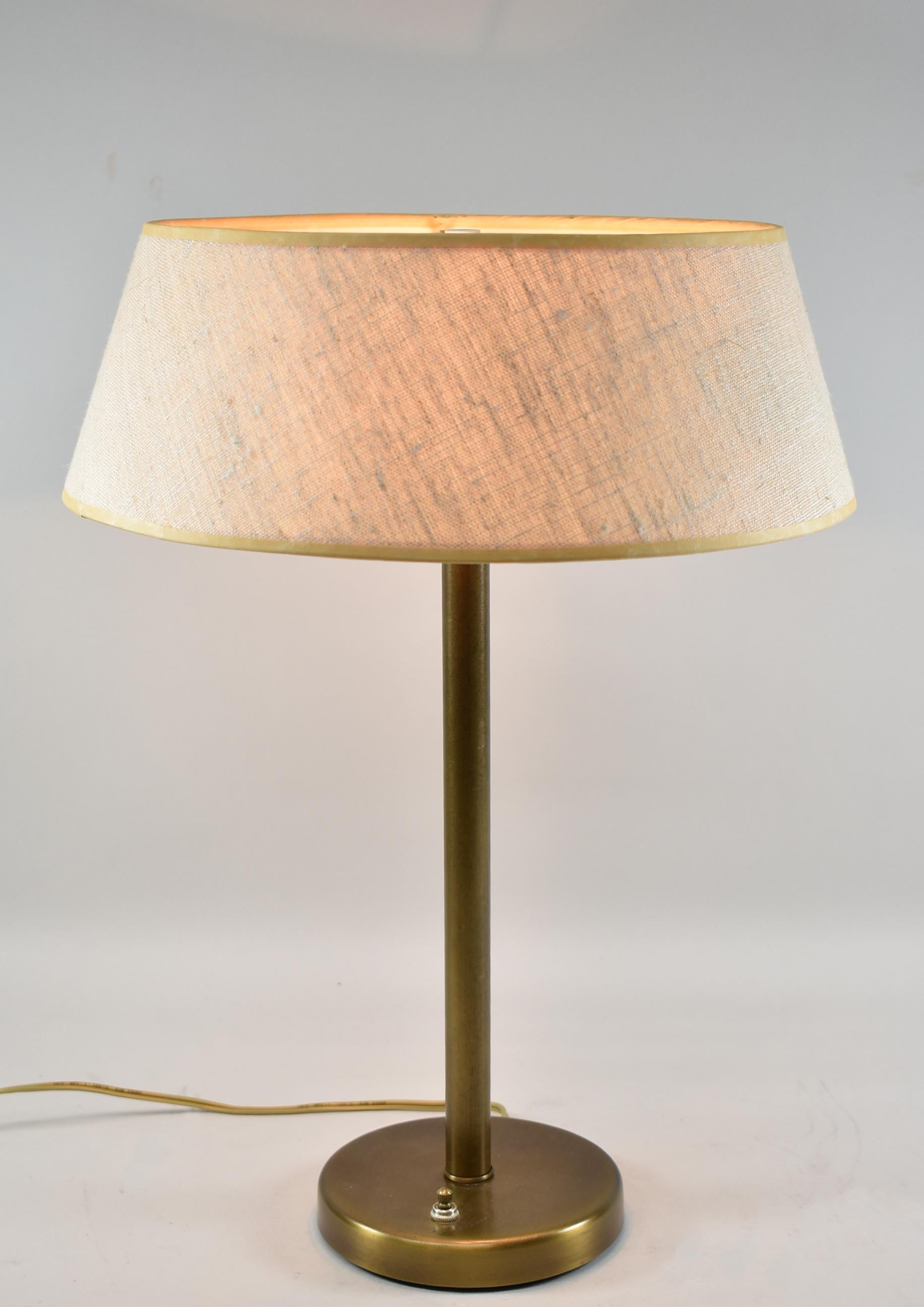 Mid-Century Modern brass table lamp attributed to Walter Von Nessen. Two sockets. One bulb switch or two.