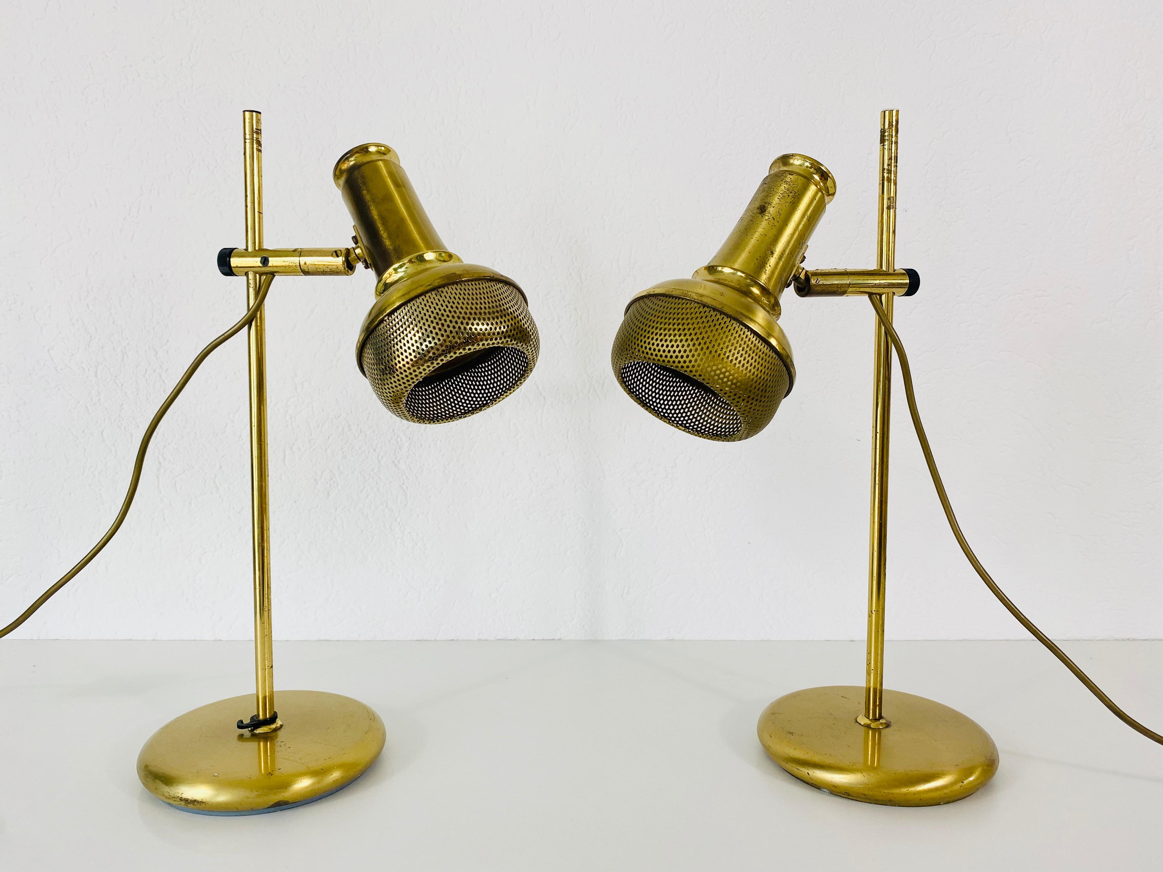 A beautiful pair of midcentury table lamps made in Germany in the 1960s. It is fascinating with its beautiful color. The table lamps are made of polished brass.

Measurements:

Base diameter 18 cm

Height 49 cm

Length 30 cm

Good vintage