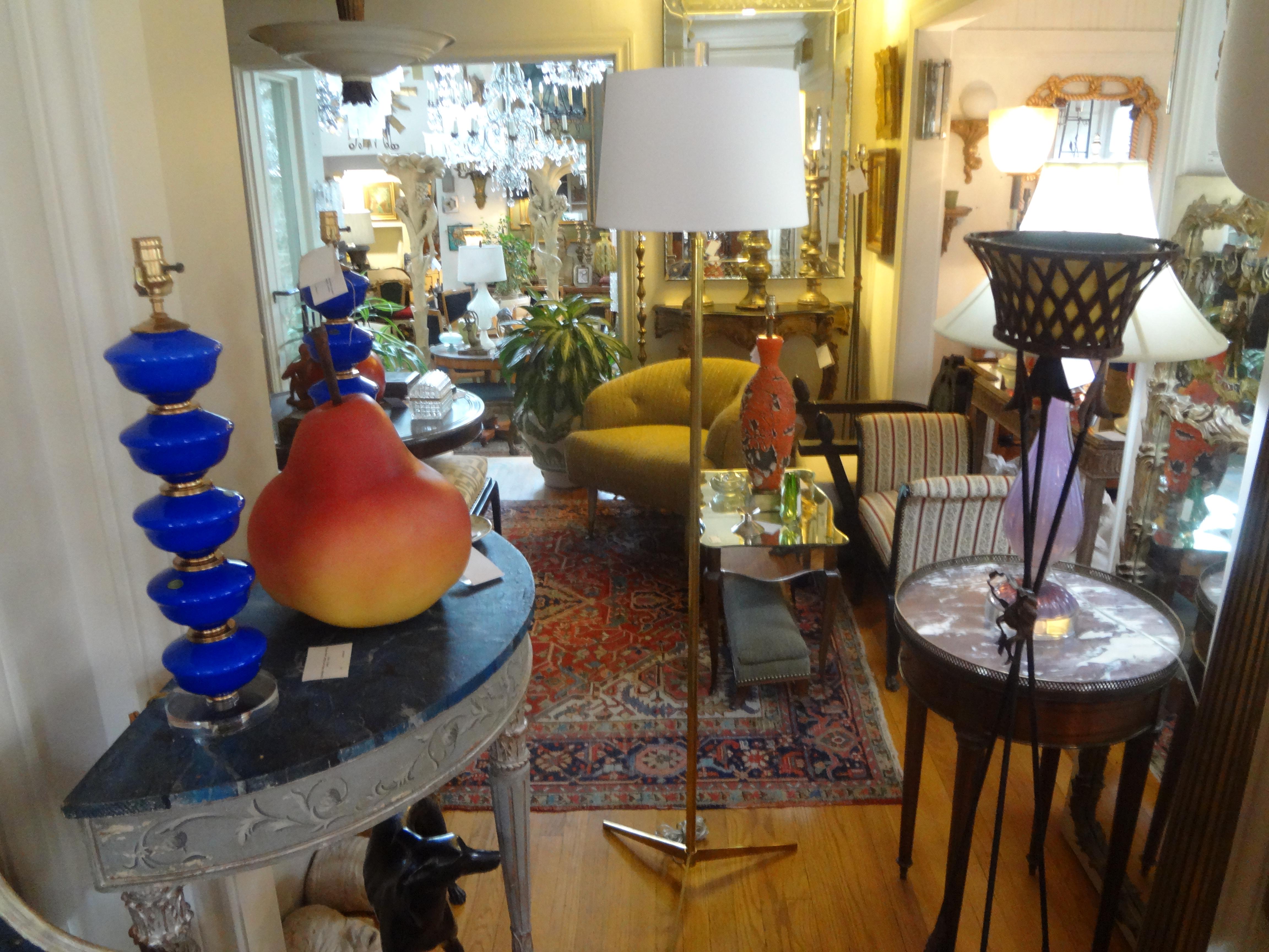 Beautiful Mid-Century Modern brass floor lamp in the manner of Paul McCobb. This modernist brass floor lamp has been newly wired with new fittings. The shade has minor wear and is best to replace.