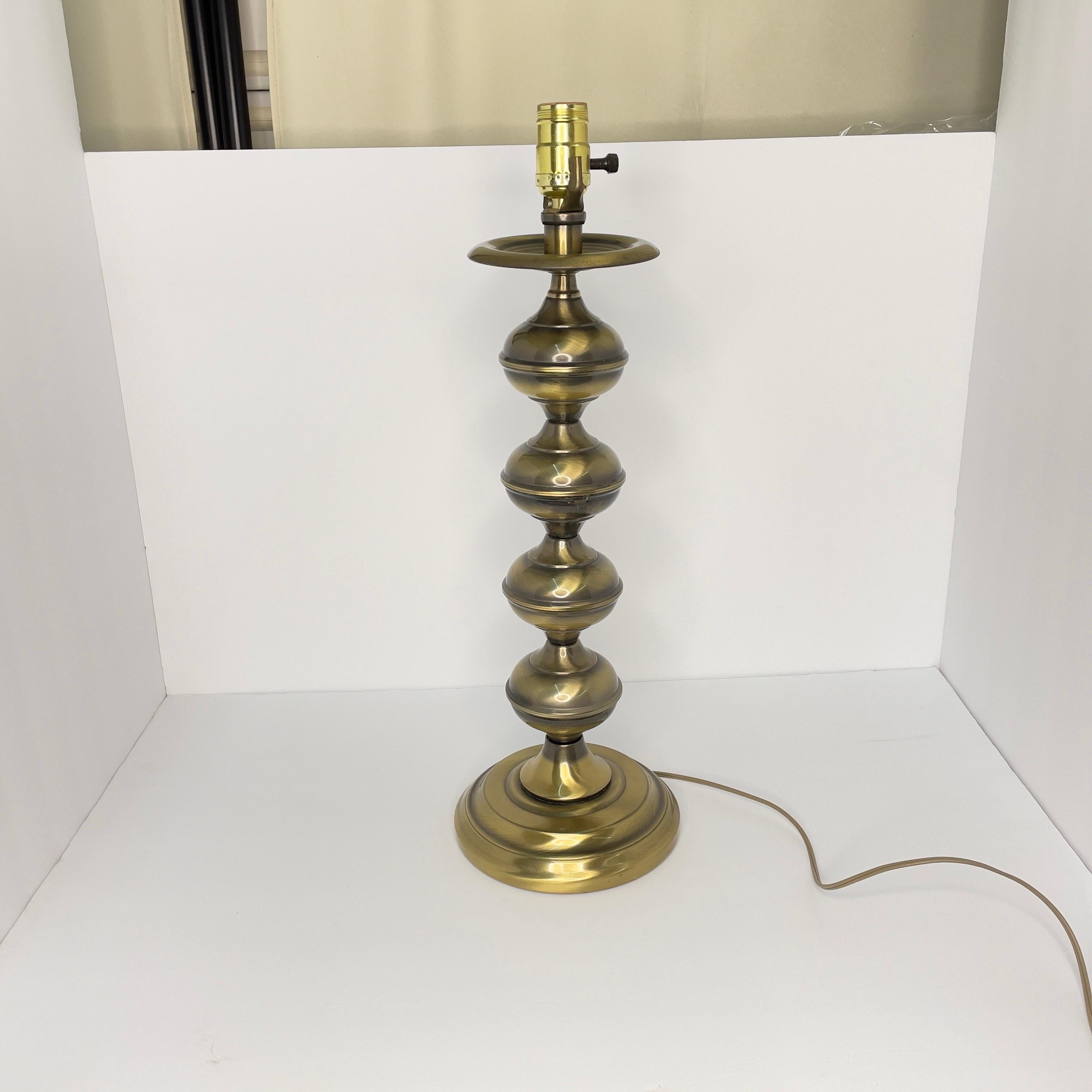 Possibly by Stiffel but, it’s unmarked. Lamp is in great shape. I didn’t notice any dents and no discoloration. It’s in overall very good condition and includes a lamp shade.

Height given is with the shade.  Shade is 14 inches wide at base.