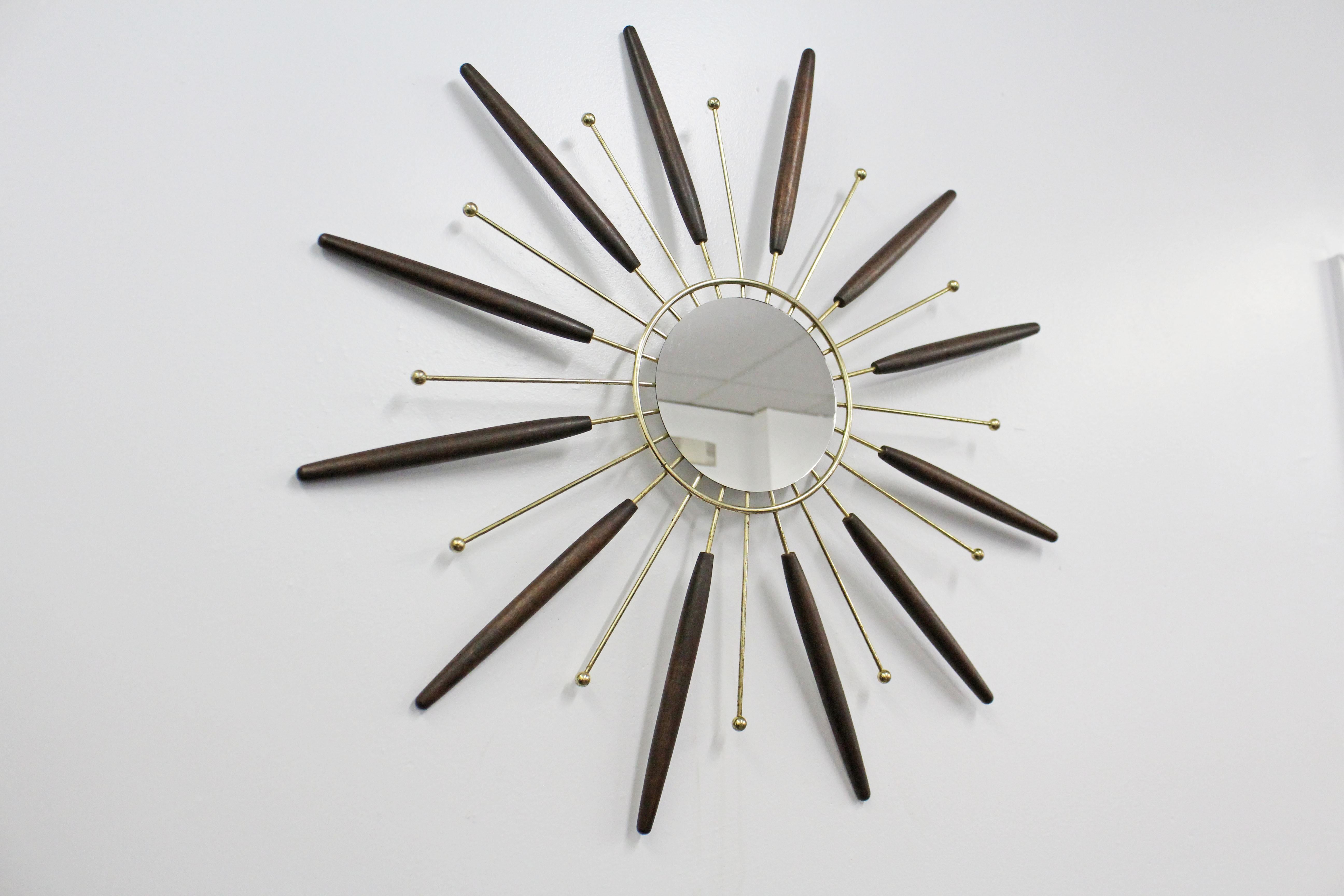 Offered is a super unique, vintage midcentury wall mirror in the shape of a 
