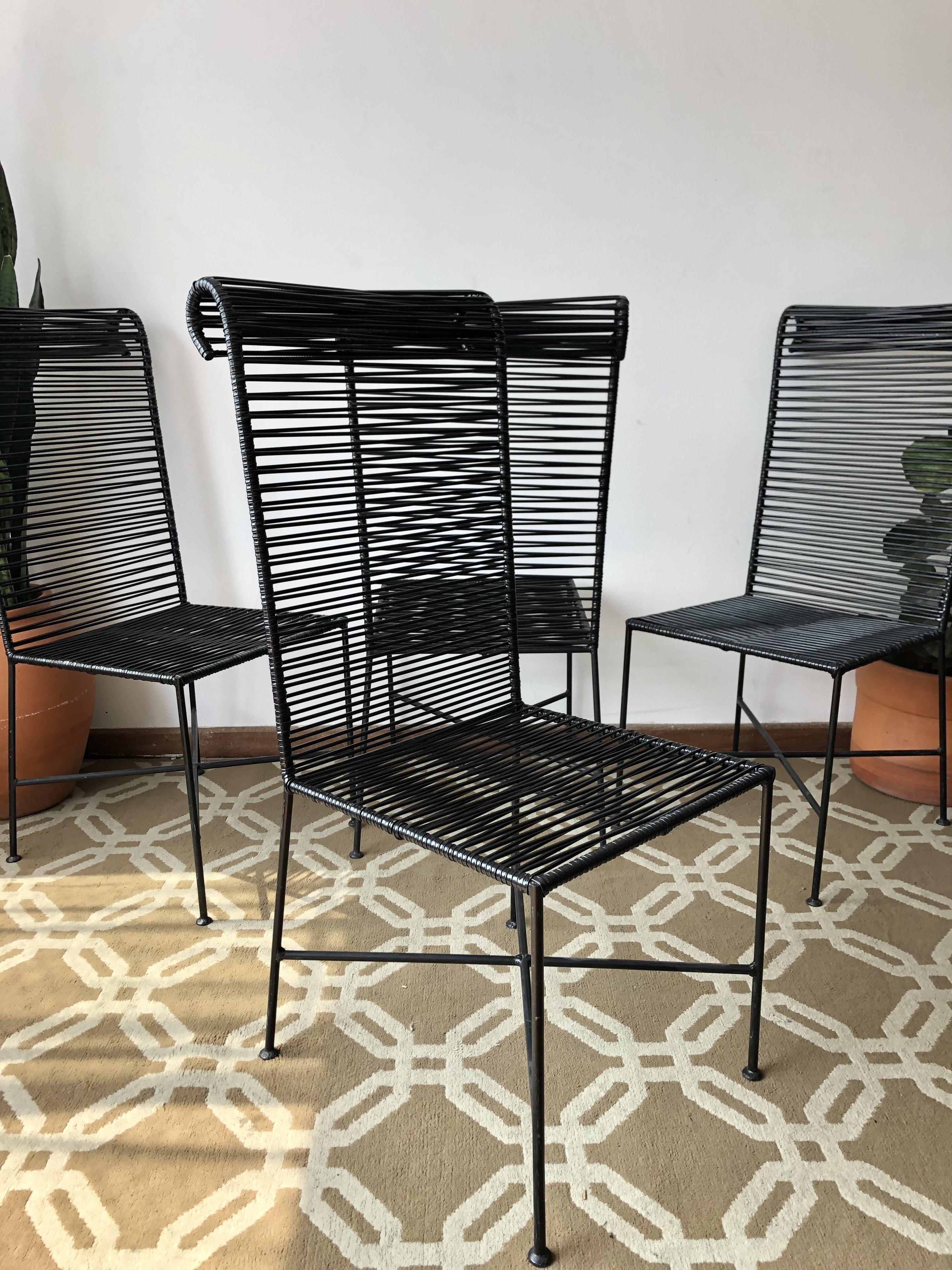 Set of 4 Mid-Century Modern Brazilian chairs with iron frames painted in black and newly made spaguetti seat/backrest. Firm and very resistant structures. In great condition.

Approximate Measures:
Height: 100.5cm / Width: 46.5cm / Depth: 65cm /