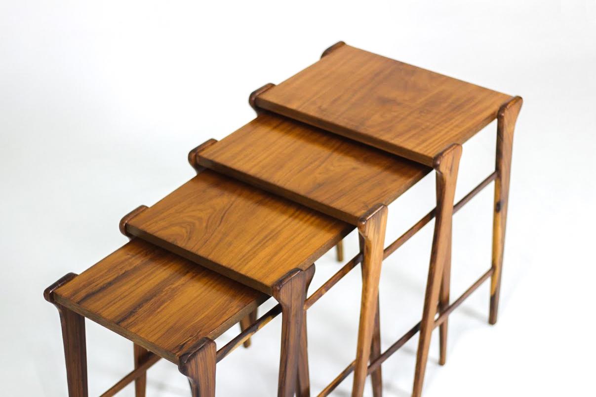 Mid-Century Modern Brazilian Wood nesting side tables, 1950s

Charming Brazilian 1950s set of four nesting tables, featuring solid wood feet with double side stretchers and plywood tabletops veneered with wood. Beautifully figured wood finished with