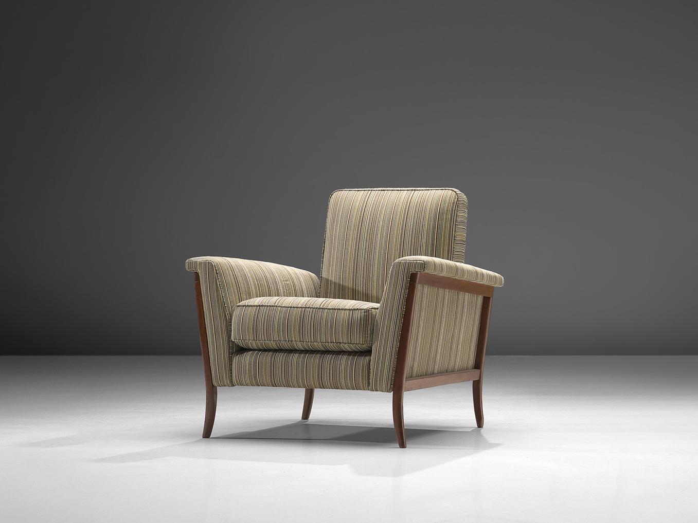 Lounge chair, mahogany, fabric, Brazil, 1960s.

Elegant Brazilian armchair. The curved frame is made of mahogany and beautifully exposed on the outside of the shell. The smaller high back adds more elegance to the design. A groove is created between