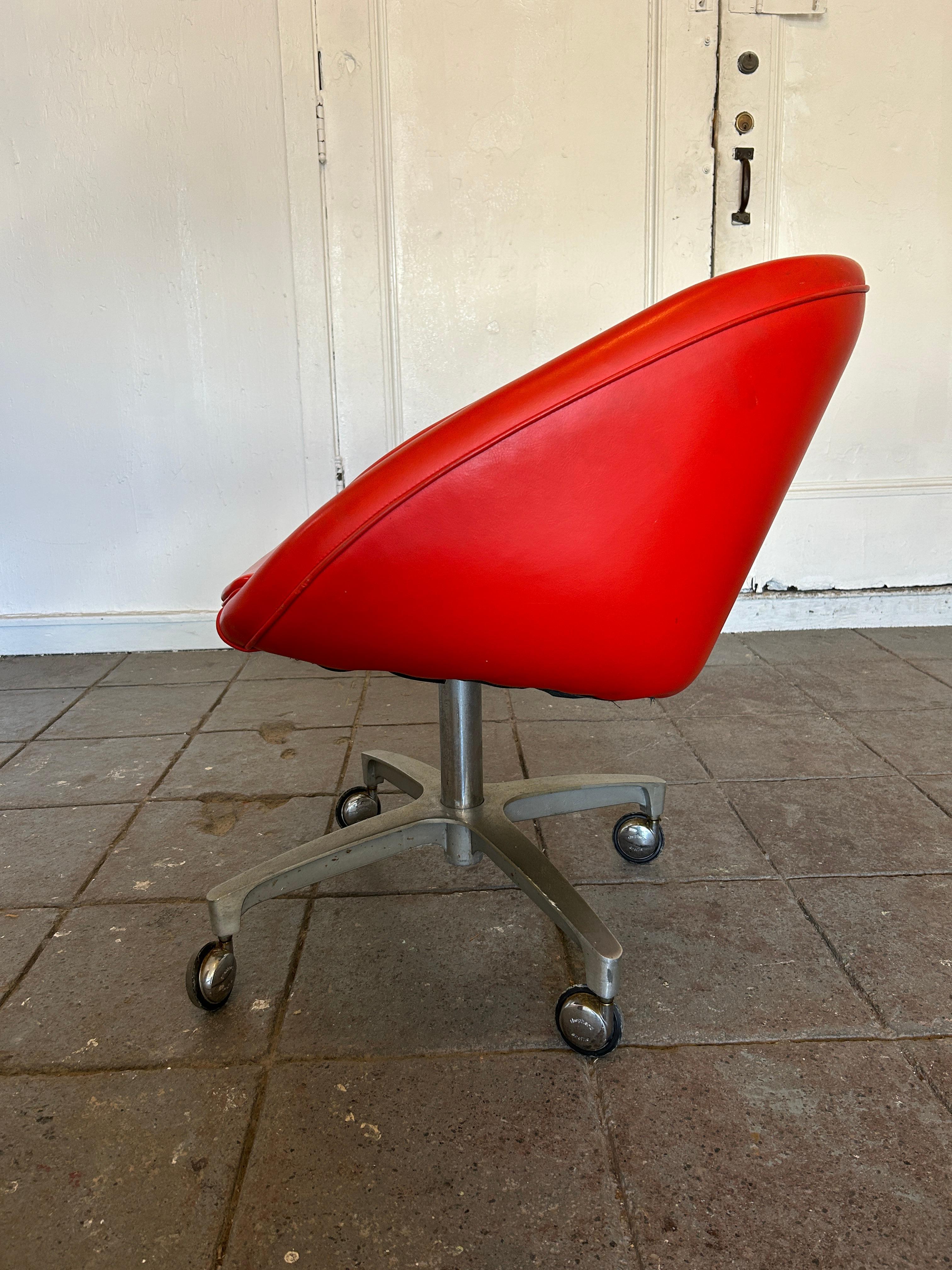 Mid-Century Modern Bright Red Vinyl Mod office chair on casters. Made by Chrome Craft. Great fun Task office chair in very good condition. Chair swivels 360 degrees. Does not Adjust in Height fixed seat Height at Standard 18
