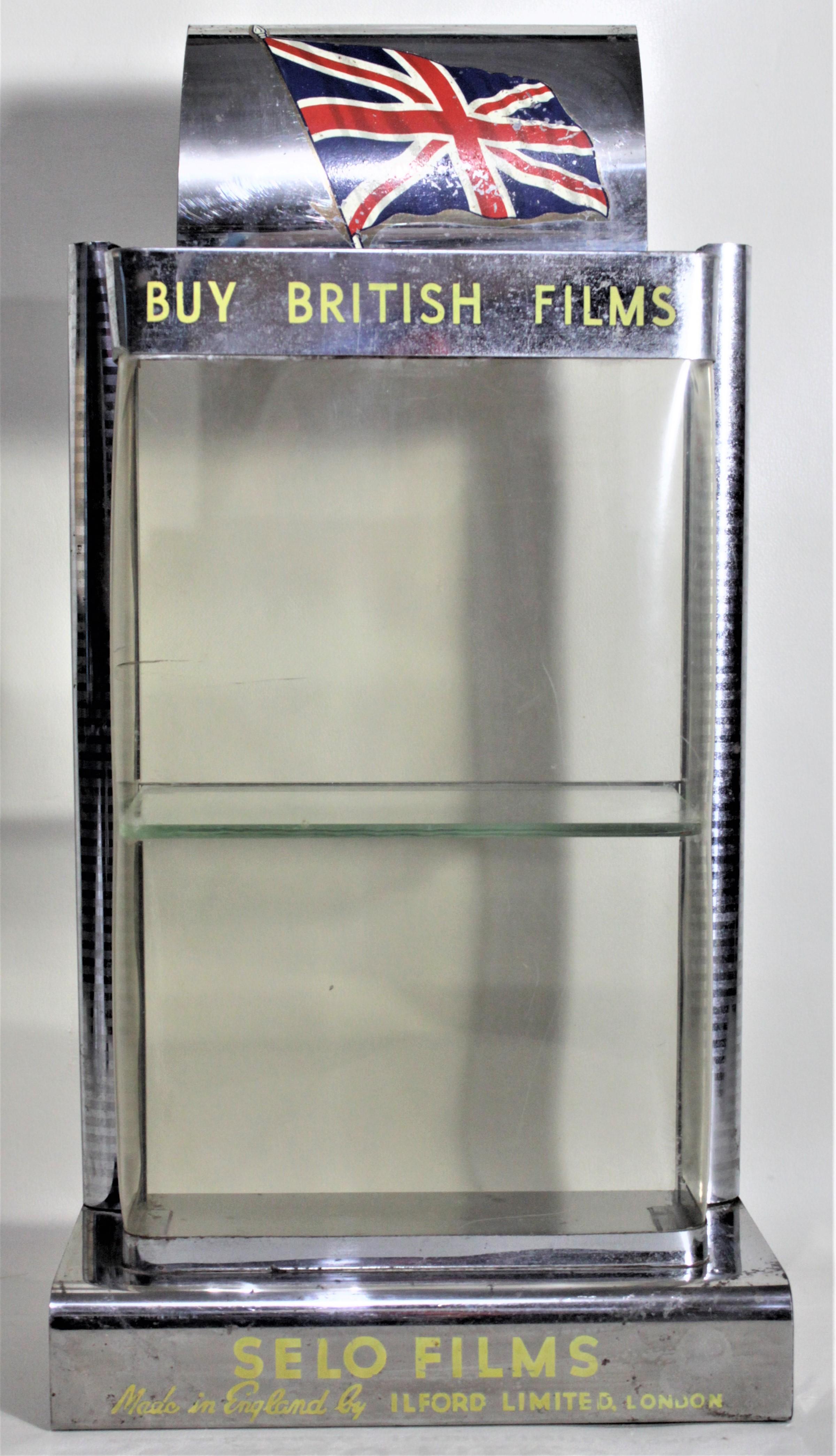 This store display was made for the English film manufacturer, Ilford to advertise their Selo film line during the 1960s in the period Mid-Century Modern style. The frame of the display is done in chromed metal with a molded plastic window. The top
