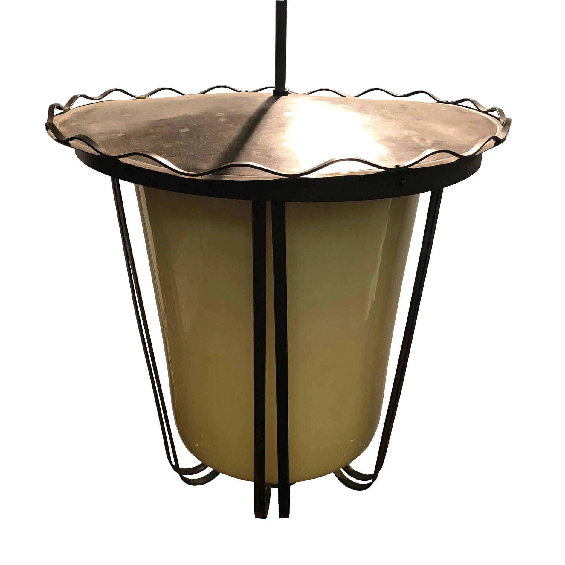 Very nice 1940s brass and glass lantern or pendant.
Hand blown Murano encased cylindrical, tapered glass diffuser in opaque beige- yellowish glass.
Very nice original condition with original period patina on brass.
Fully working and tested