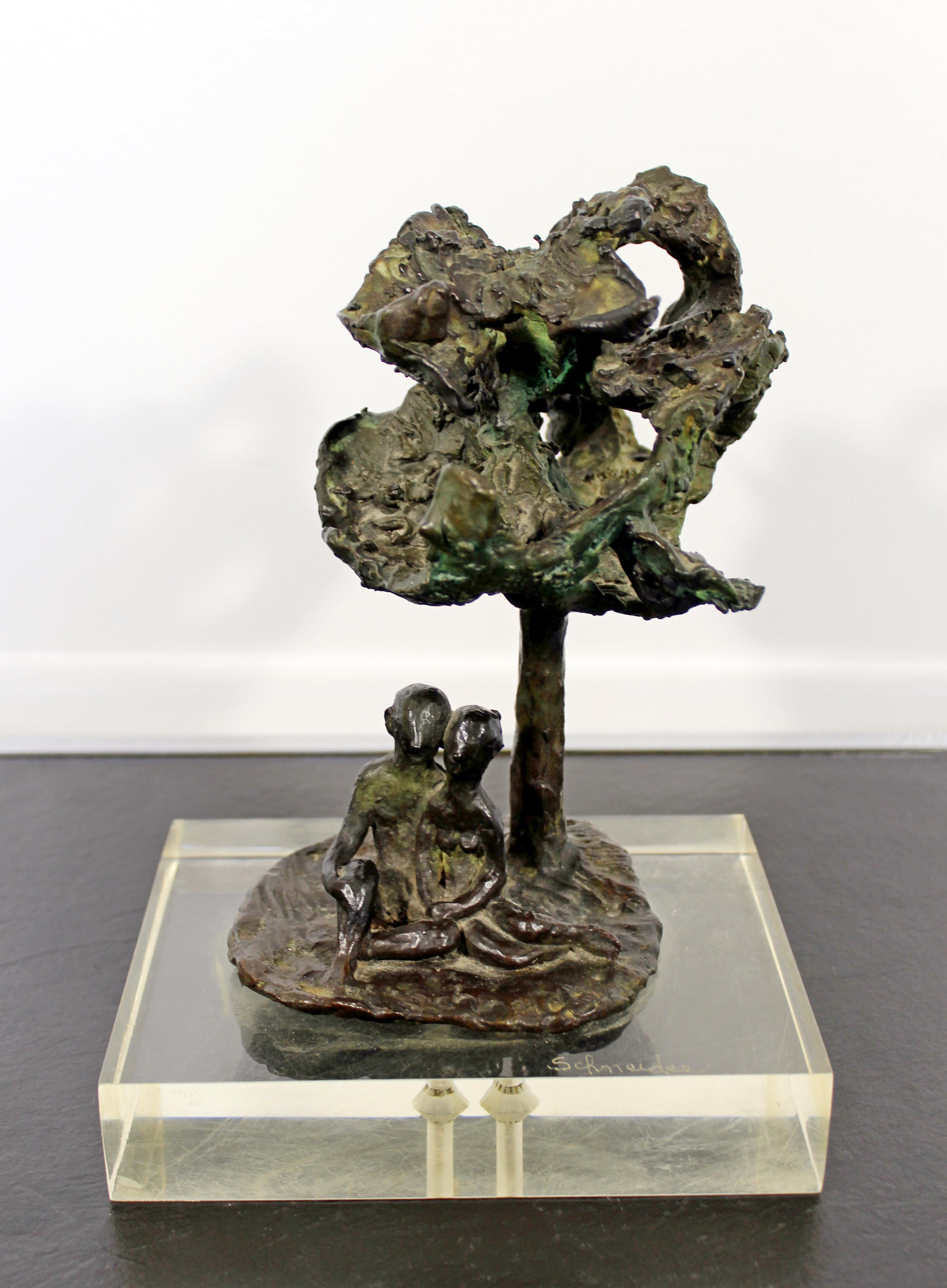 For your consideration is a marvelous art sculpture of figures under a tree, made of bronze on a Lucite base, signed by Arthur Schneider, circa the 1970s. In excellent condition. The dimensions are 7.5