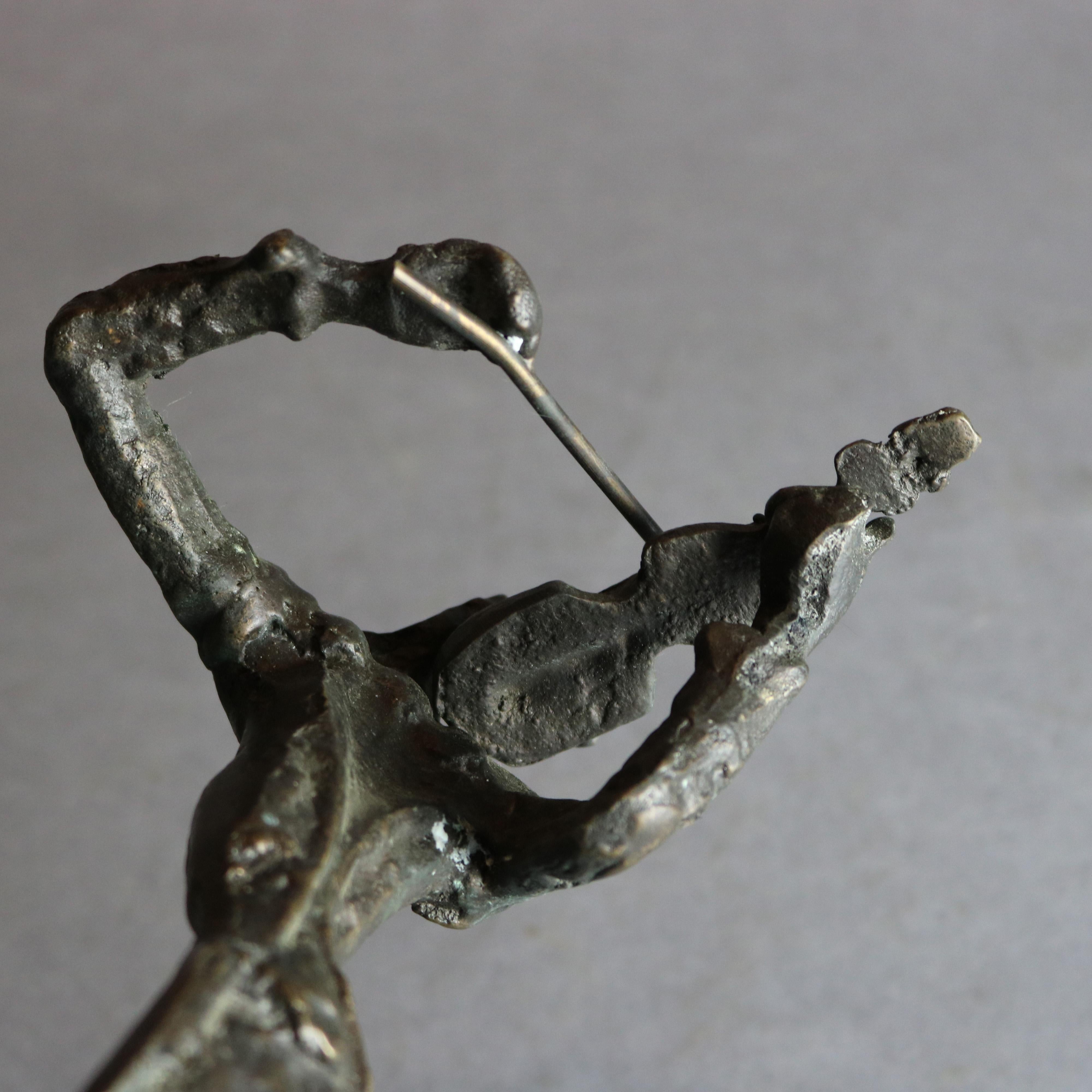 A Mid-Century Modern figural Brutalist sculpture offers bronze musician playing violin, unsigned, c1960

Measures: 15