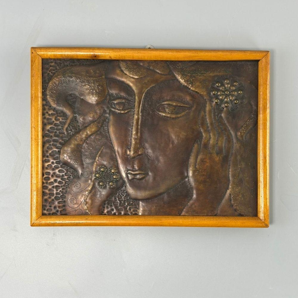 Exciting mid-century wall picture in a period wooden frame in good condition. Unique metalwork, image of an experienced creator from the 1960s.  Graceful elongated female head, meticulously worked details. A peculiar mixture of social realism, naive