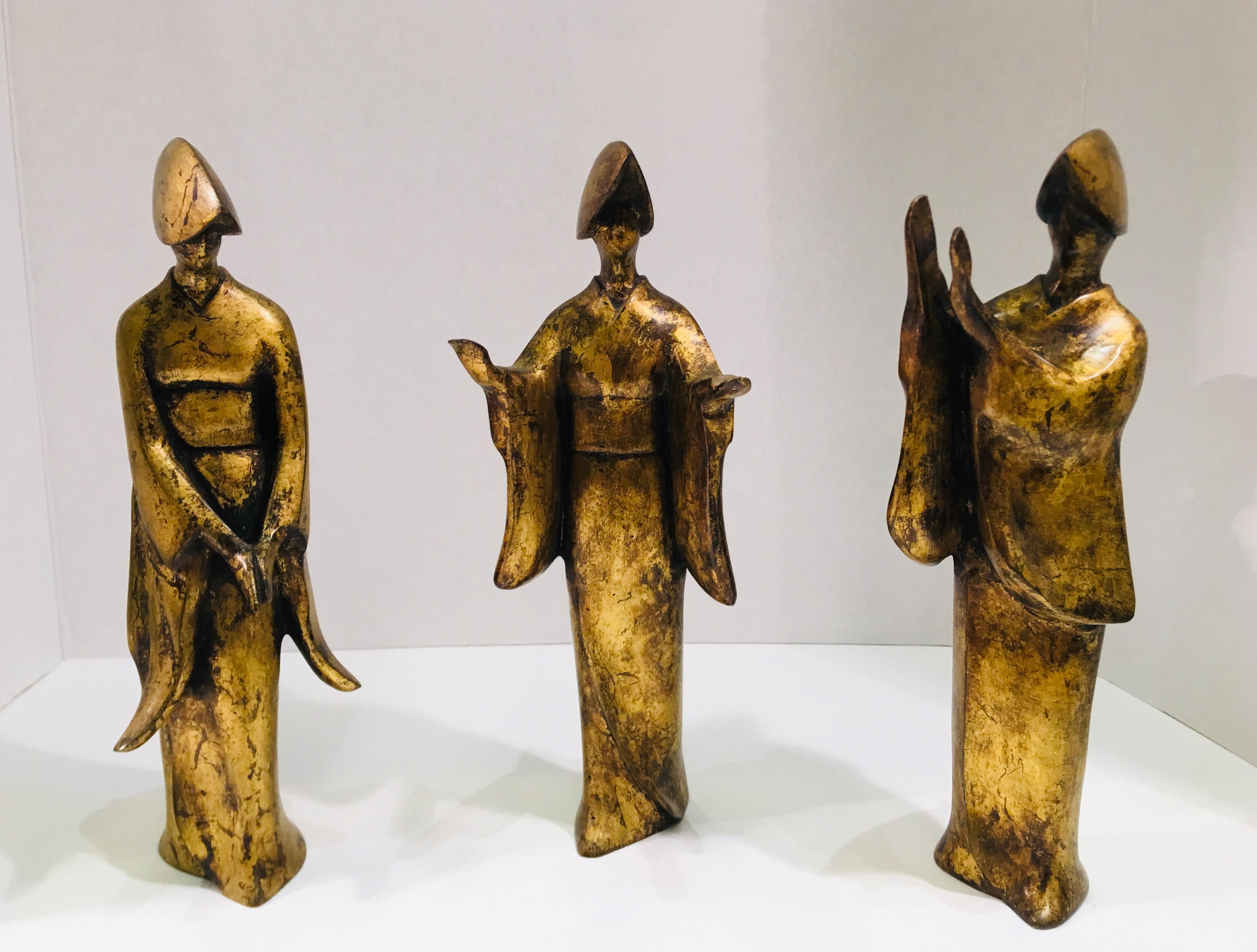 Set of 3 stylized, Mid-Century Modern, abstract bronze figurines with a variegated gold patina depict female Japanese Awa Odori dancers in different positions. The Awa Odori dance is held in mid-August during the Bon Festival, a time when the