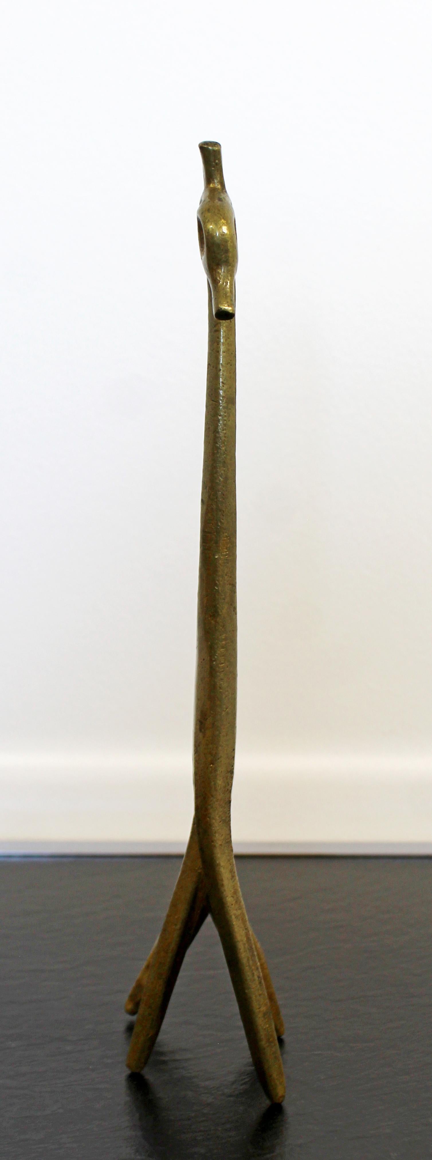 For your consideration is a unique, bronze, Brutalist table sculpture, of a giraffe, signed by Frederick Weinberg, circa 1950s. In excellent vintage condition. The dimensions are 3.5