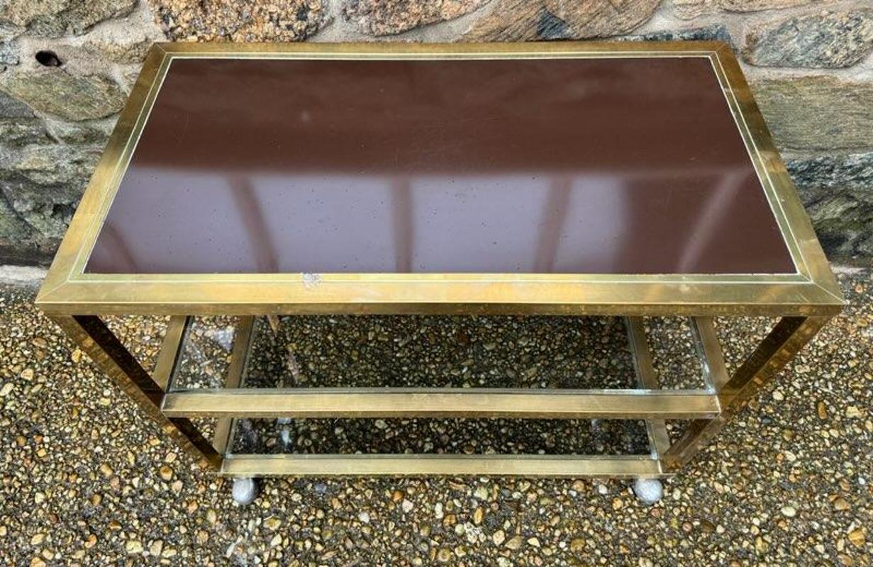 Mid-Century Modern Bronze Glass & Laminate Bar Cart on Wheels
Circa 1970. Measures: 25.75