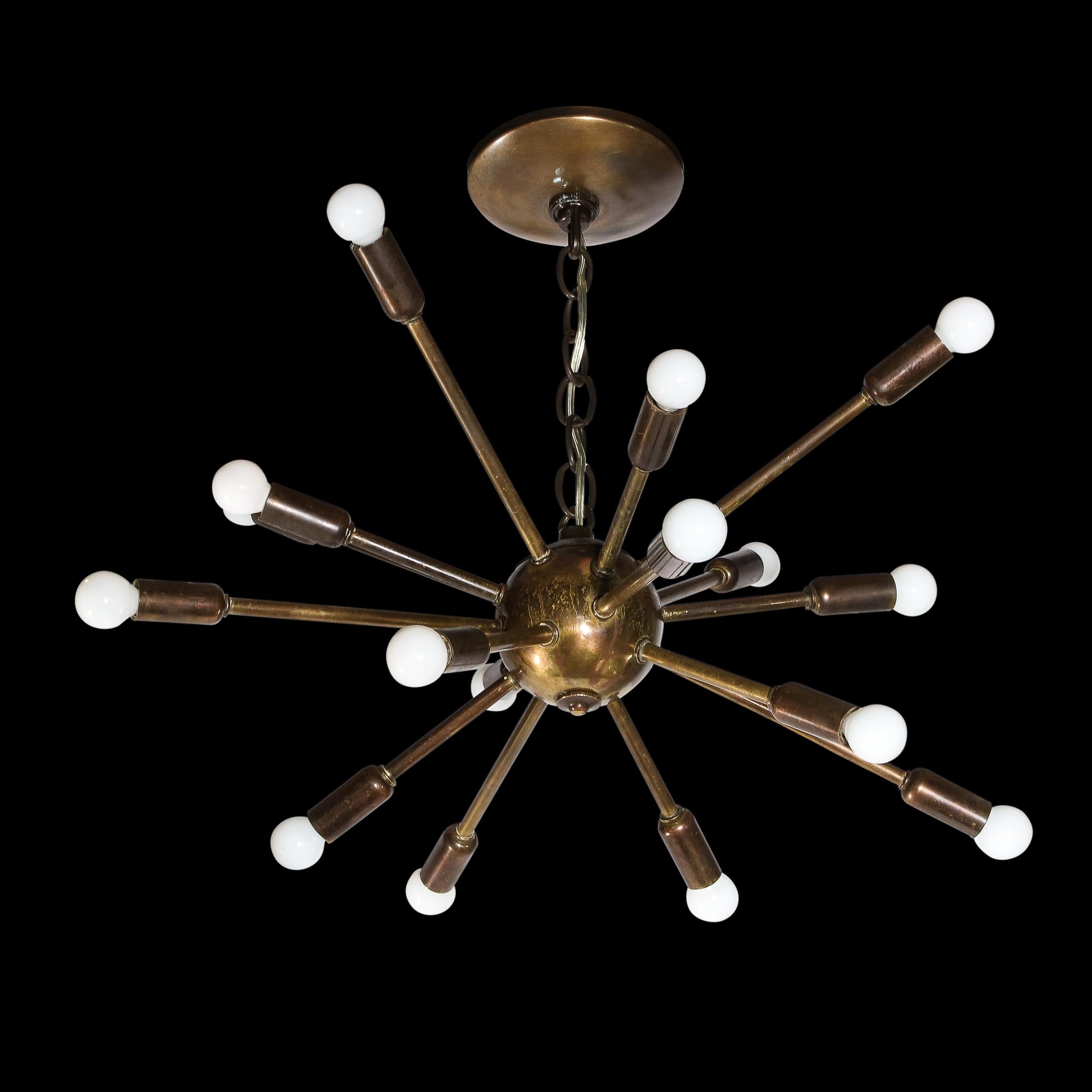 This refined and graphic Sputnik chandelier was crafted in Italy, circa 1960. It features sixteen arms emanating outwards from a spherical body capped on the end with candelabra bulbs. With its sculptural Silhouette, clean modernist lines, and