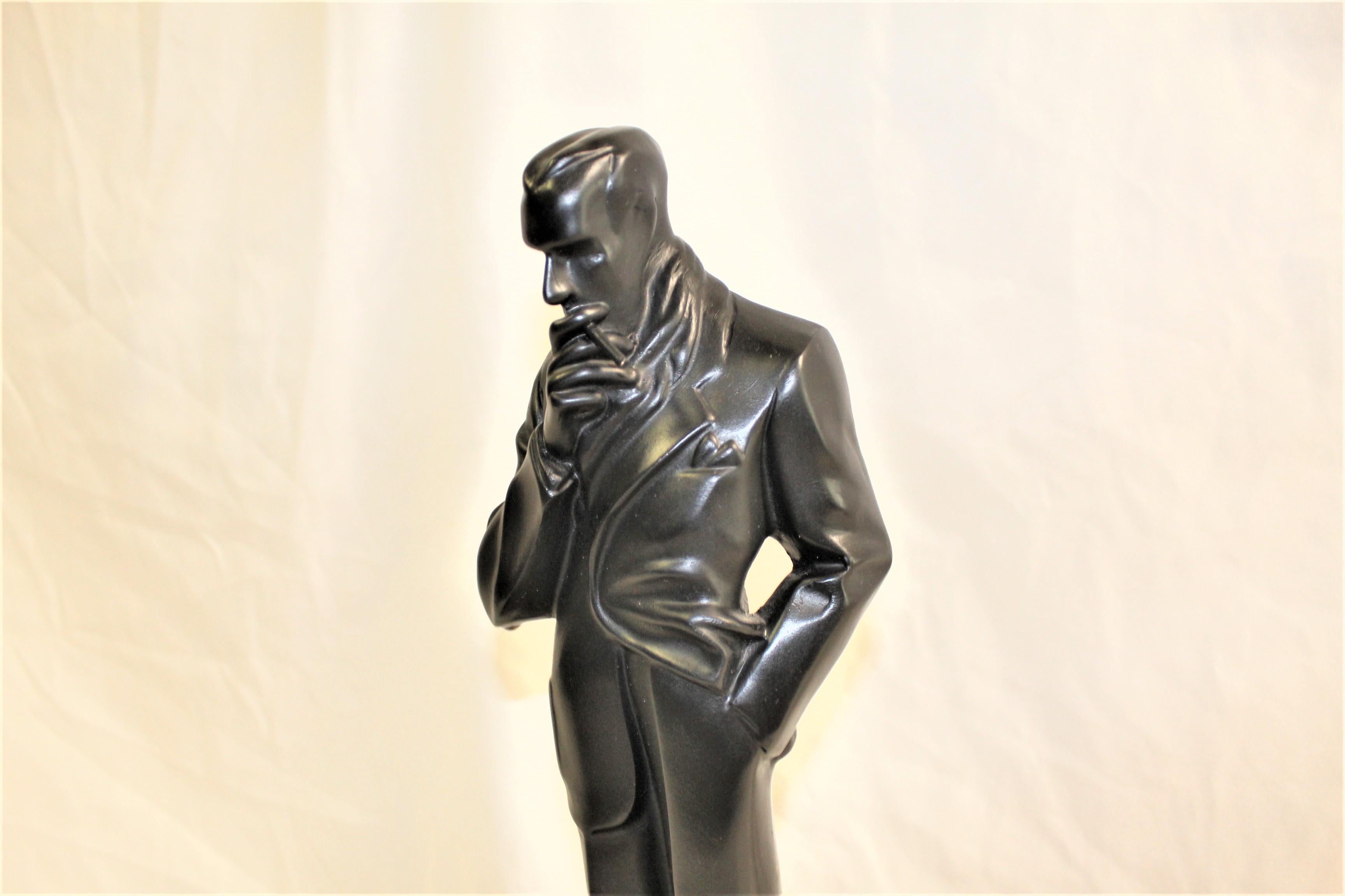 A mid century bronze contemporary cast ( Smoker ). In the manner of J C Leyendecker. From a private collector. Bronze with black patina mounted on an absolute black marble base with name tag. This one is very hard to find. Stands 18.5