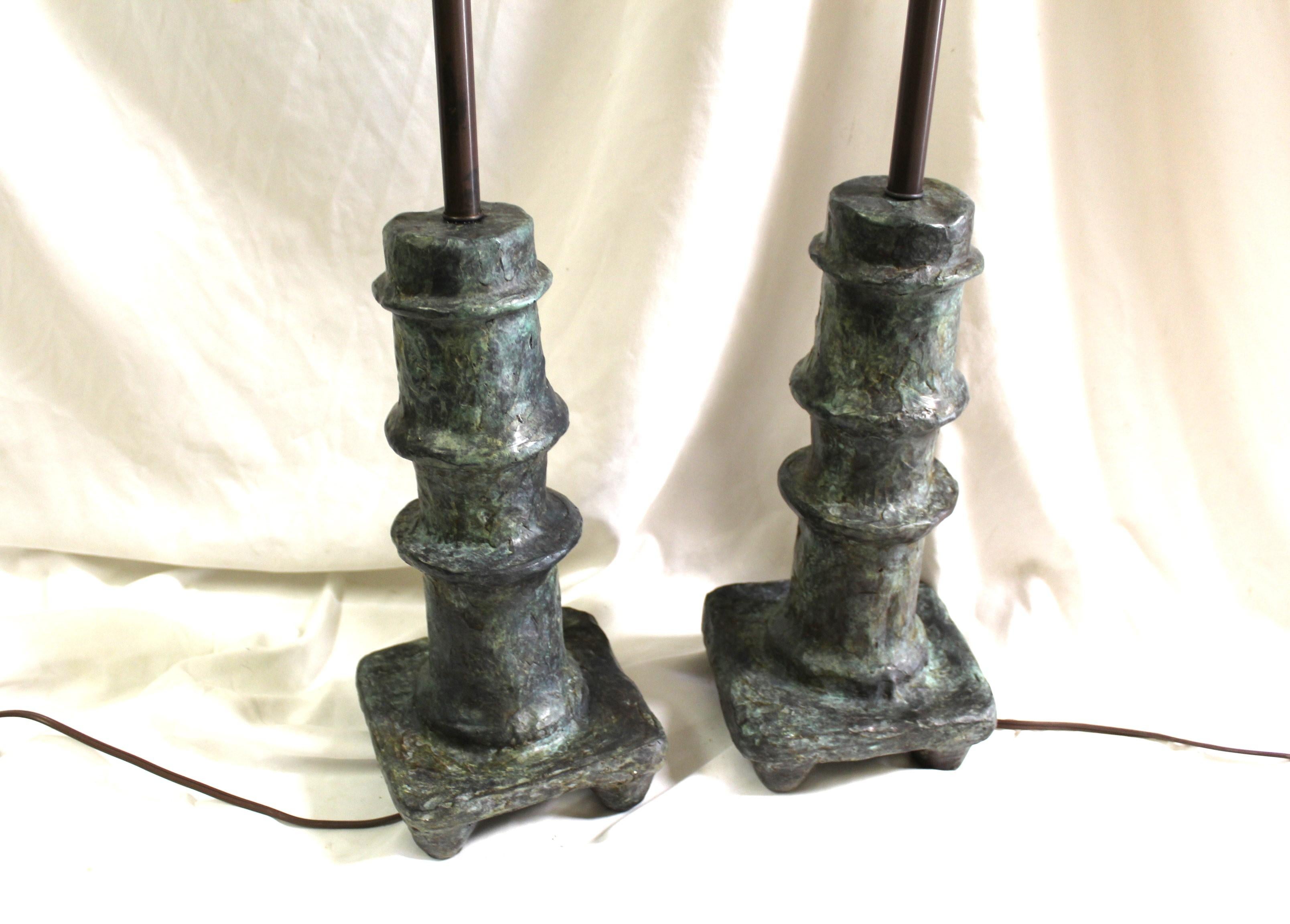 A heavy bronze casting in the Art Nouveau style after the designs by Giacometti from the 40,s . The typical look and texture of the bronze .Has the multi-patina finish in green,s and Brown . A very well made casting .They are good looking Lamps in