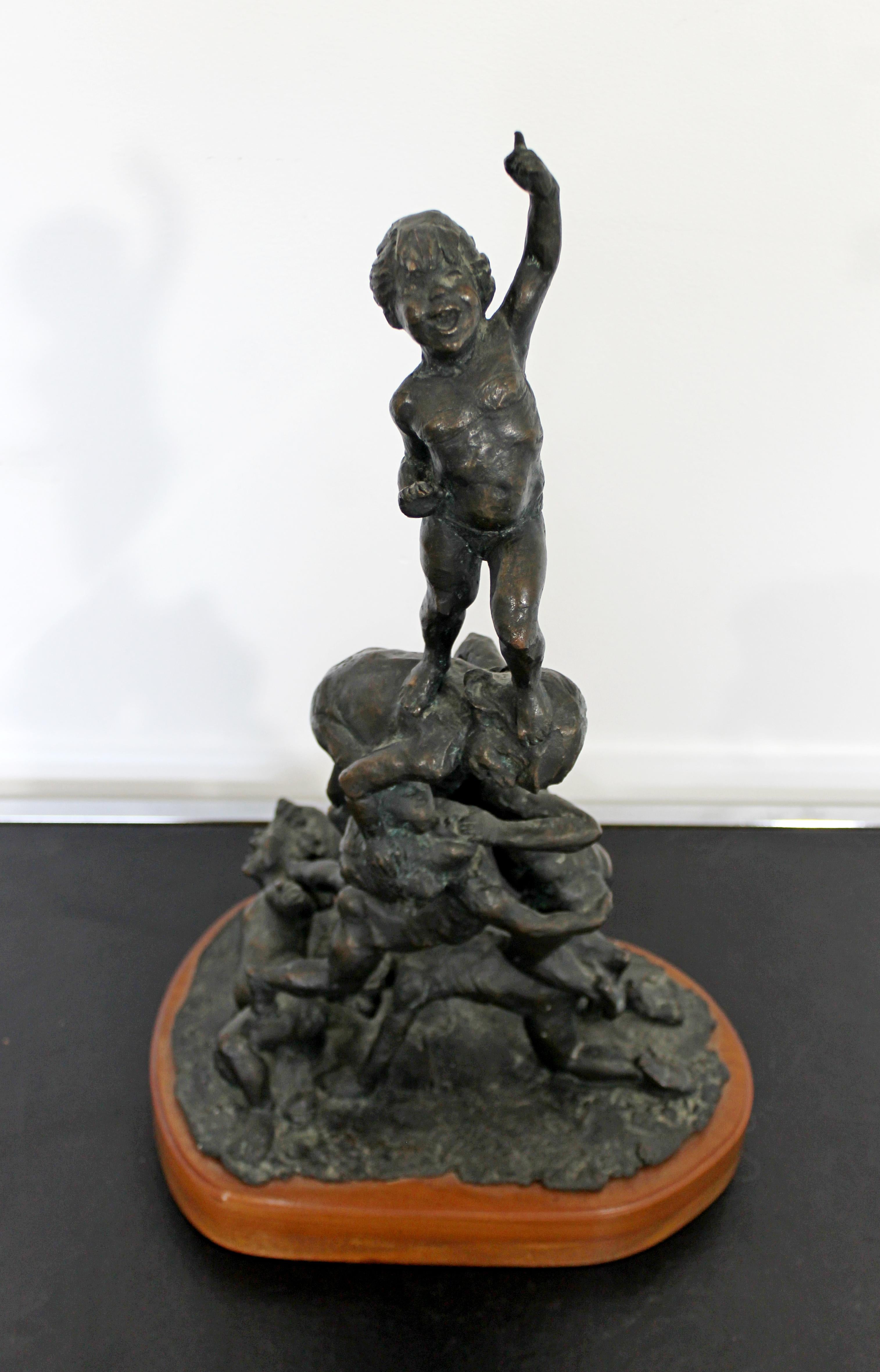 For your consideration is a marvelous, bronze table sculpture, on a wood base, signed Edward Chesney, and dated 1972. In excellent condition. The dimensions are 11