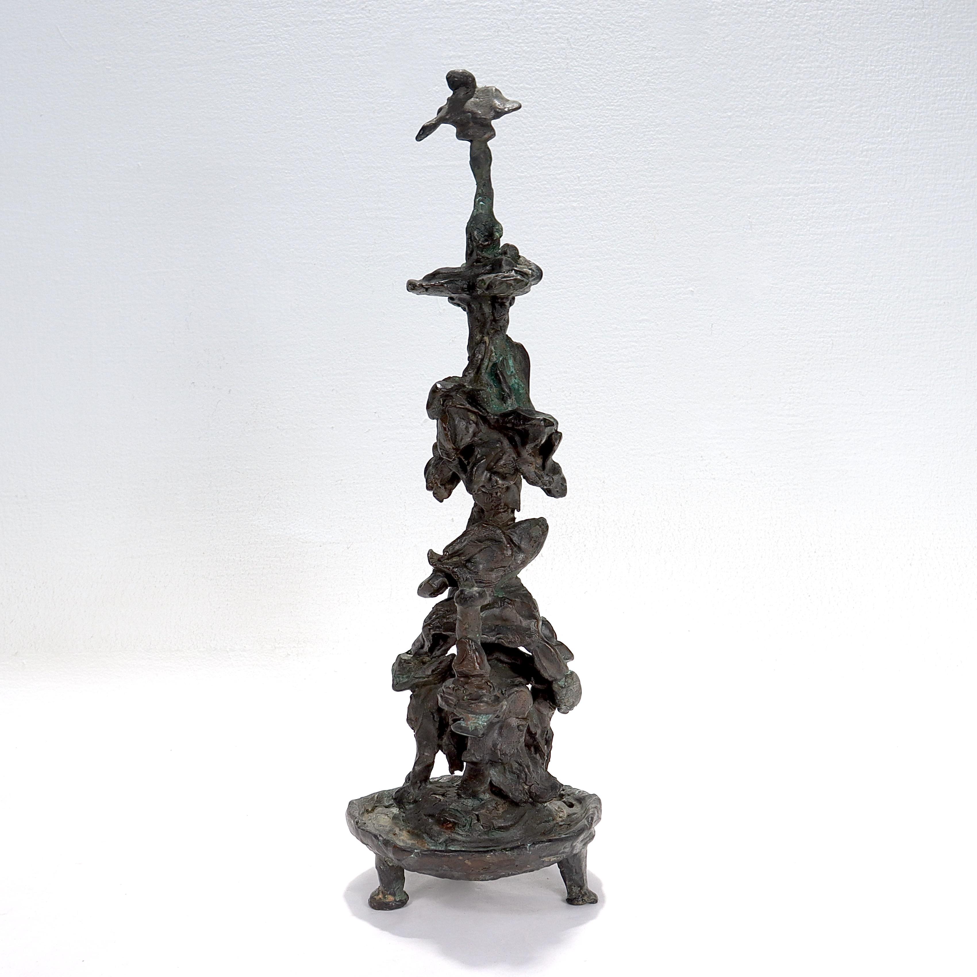 A fine mid-century bronze sculpture.

In the form of a stylized totem. 

With a round plinth supported by 3 legs (and thus a little prone to tipping).

Simply a wonderful sculpture! 

Date:
mid to late 20th century

Marks: 
Apparently