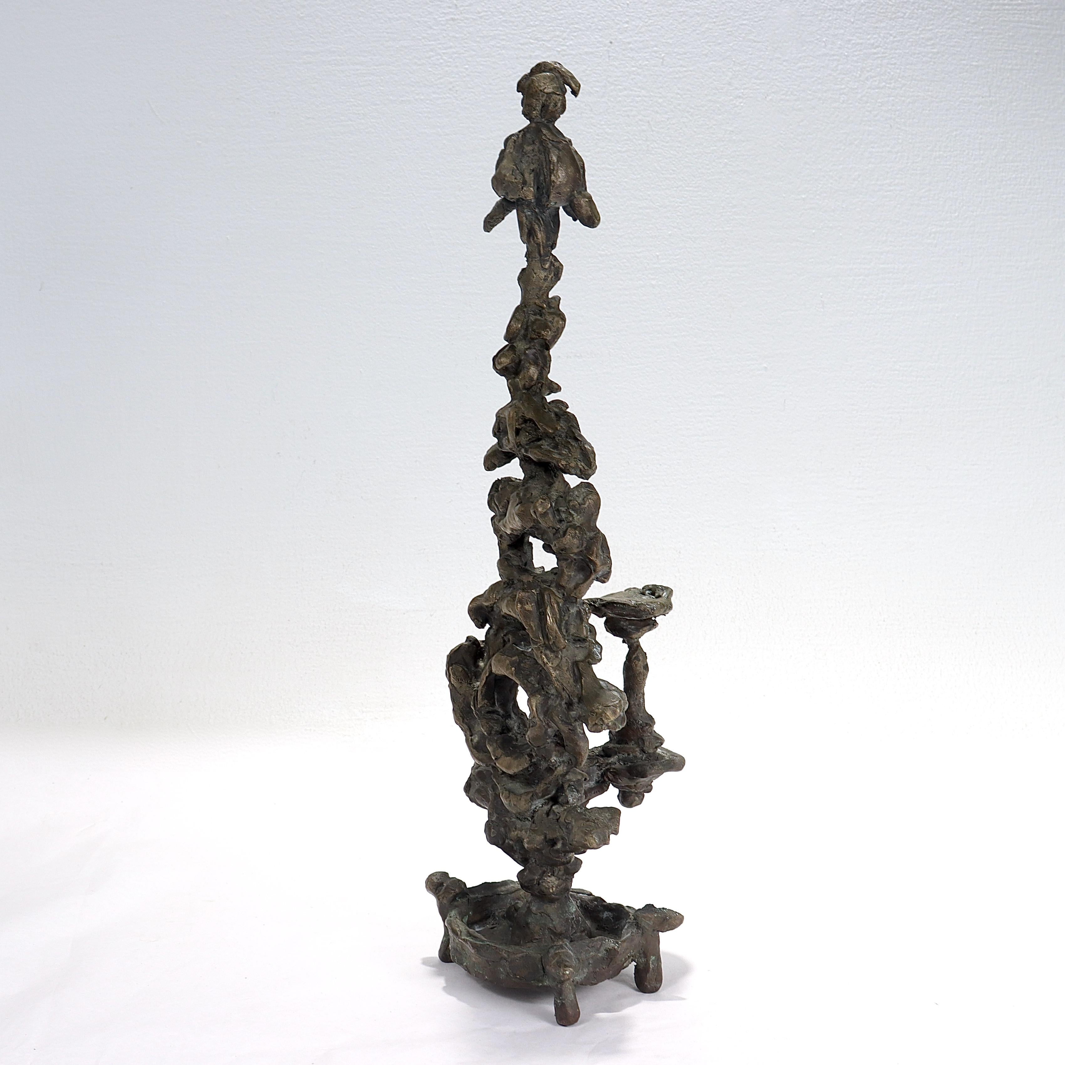 A fine midcentury bronze sculpture.

In the form of a stylized totem.

With a round plinth supported by 4 legs.

Simply a wonderful sculpture. 

Date:
Mid tolate 20th century.

Marks: 
Apparently unmarked.

Overall condition:
It is in
