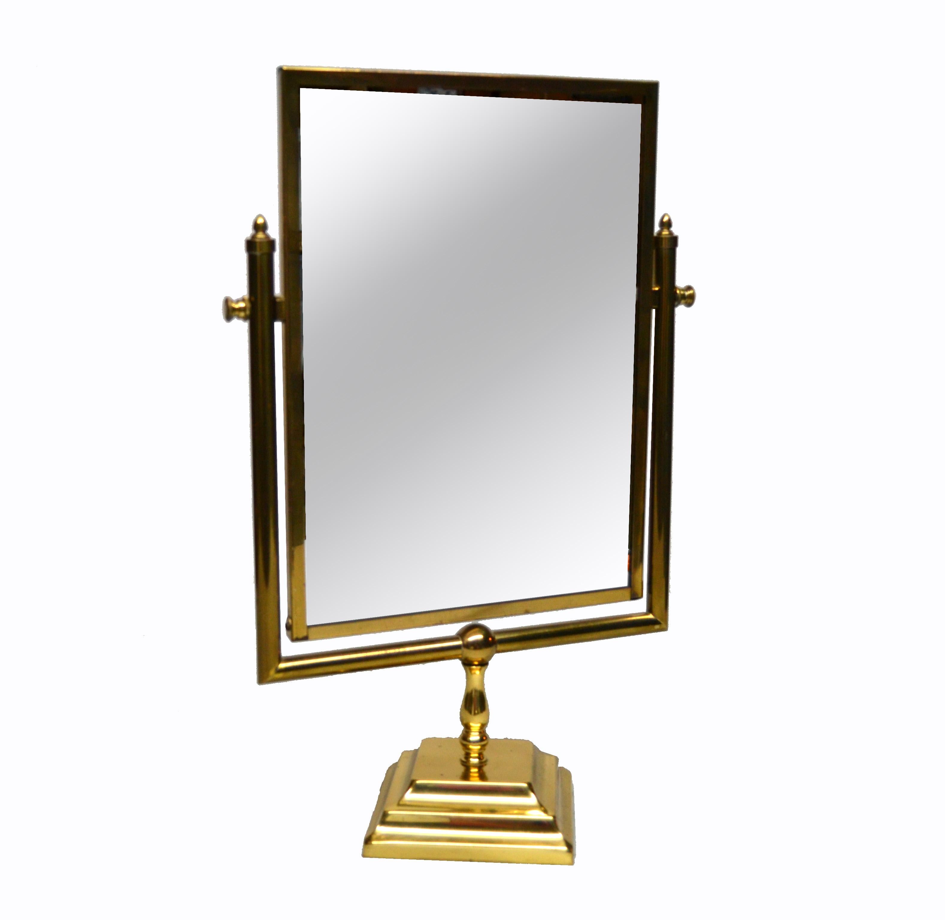 Lovely Mid-Century Modern desktop bronze two-sided vanity mirror. 
Decorated with detailed brass hardware and mounted on a Bronze base.
Can be directed to different angles.
Mirror size: 9 inches x 13.25 inches.