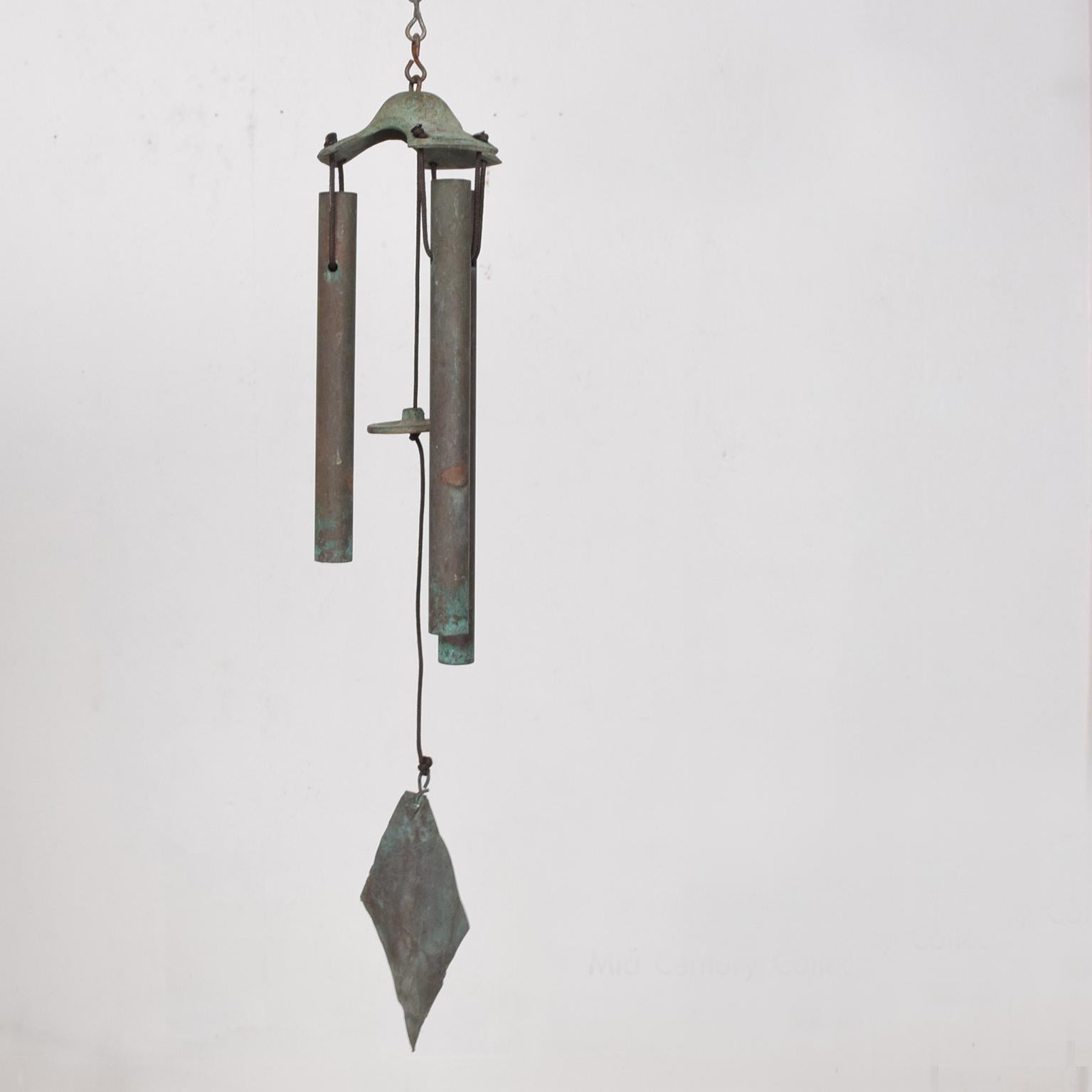 A Mid-Century Modern wind chime in patinated bronze, 
circa 1960s.
Measures: 27
